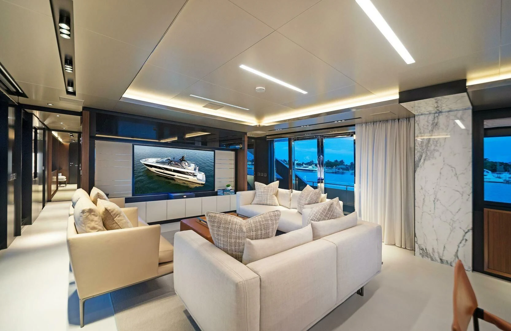a living room with a large screen aboard ALEGRA Yacht for Sale