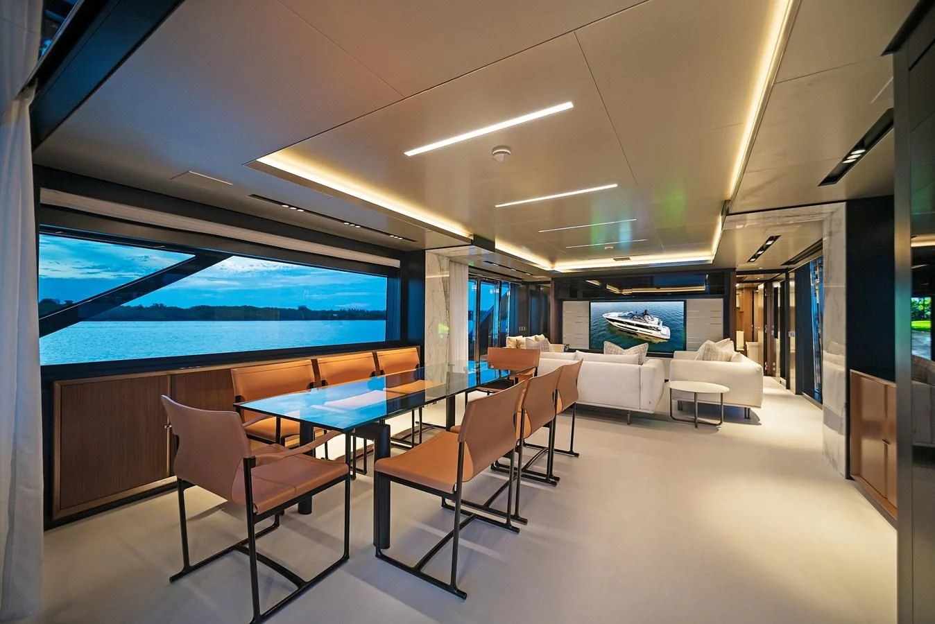 a room with a table chairs and a large window aboard ALEGRA Yacht for Sale