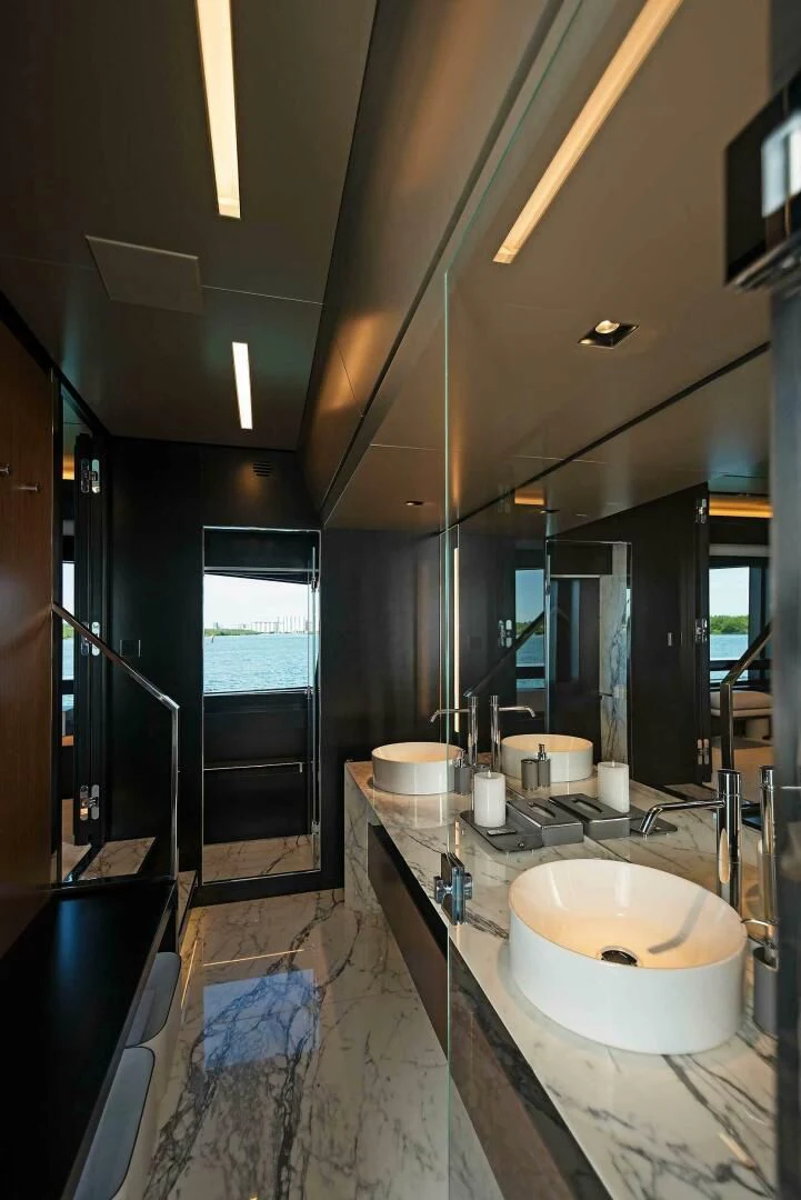 a bathroom with sinks and mirrors aboard ALEGRA Yacht for Sale
