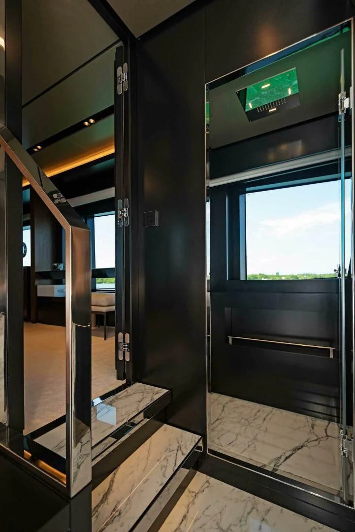 a hallway with glass doors aboard ALEGRA Yacht for Sale