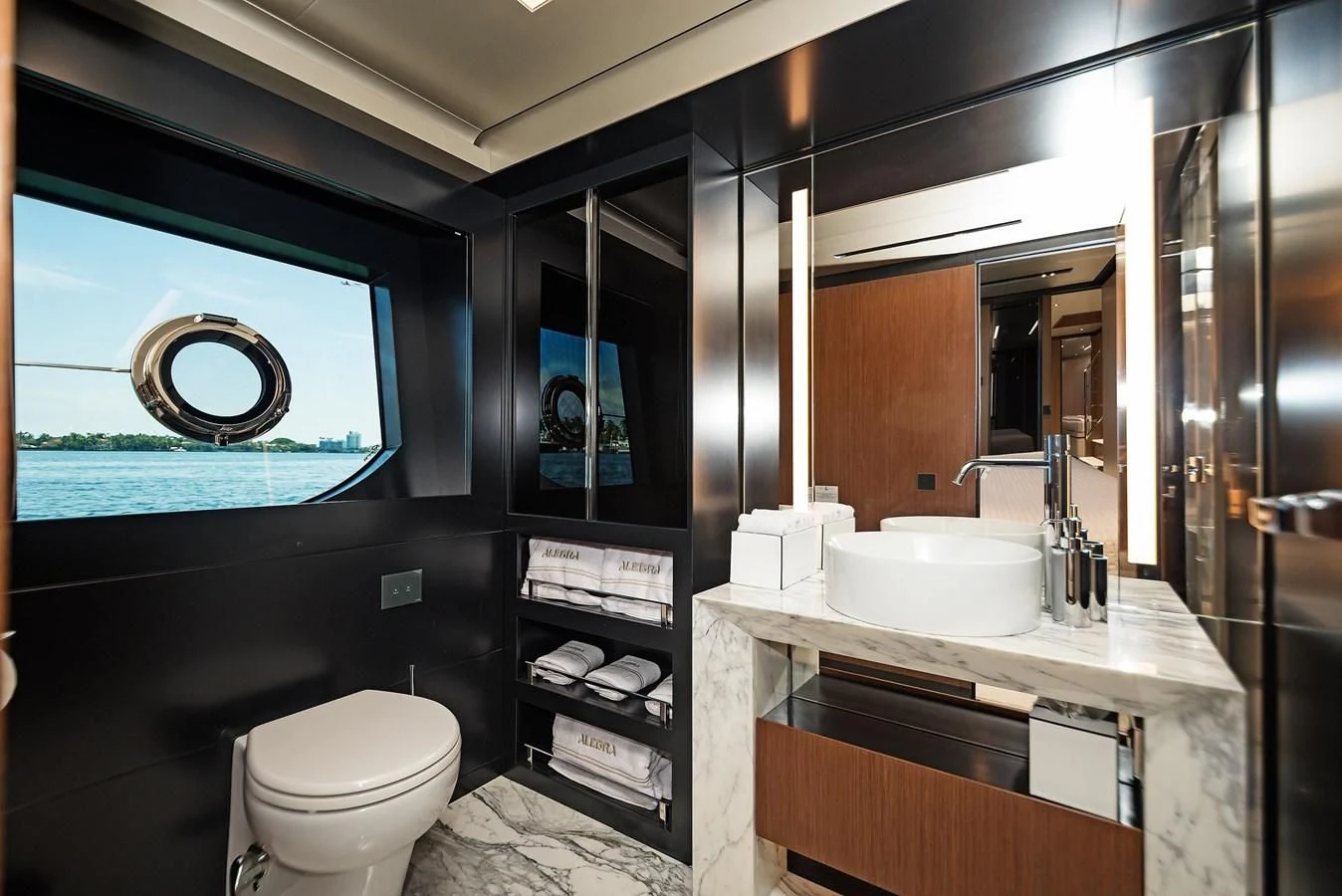 a bathroom with a sink toilet and a mirror aboard ALEGRA Yacht for Sale