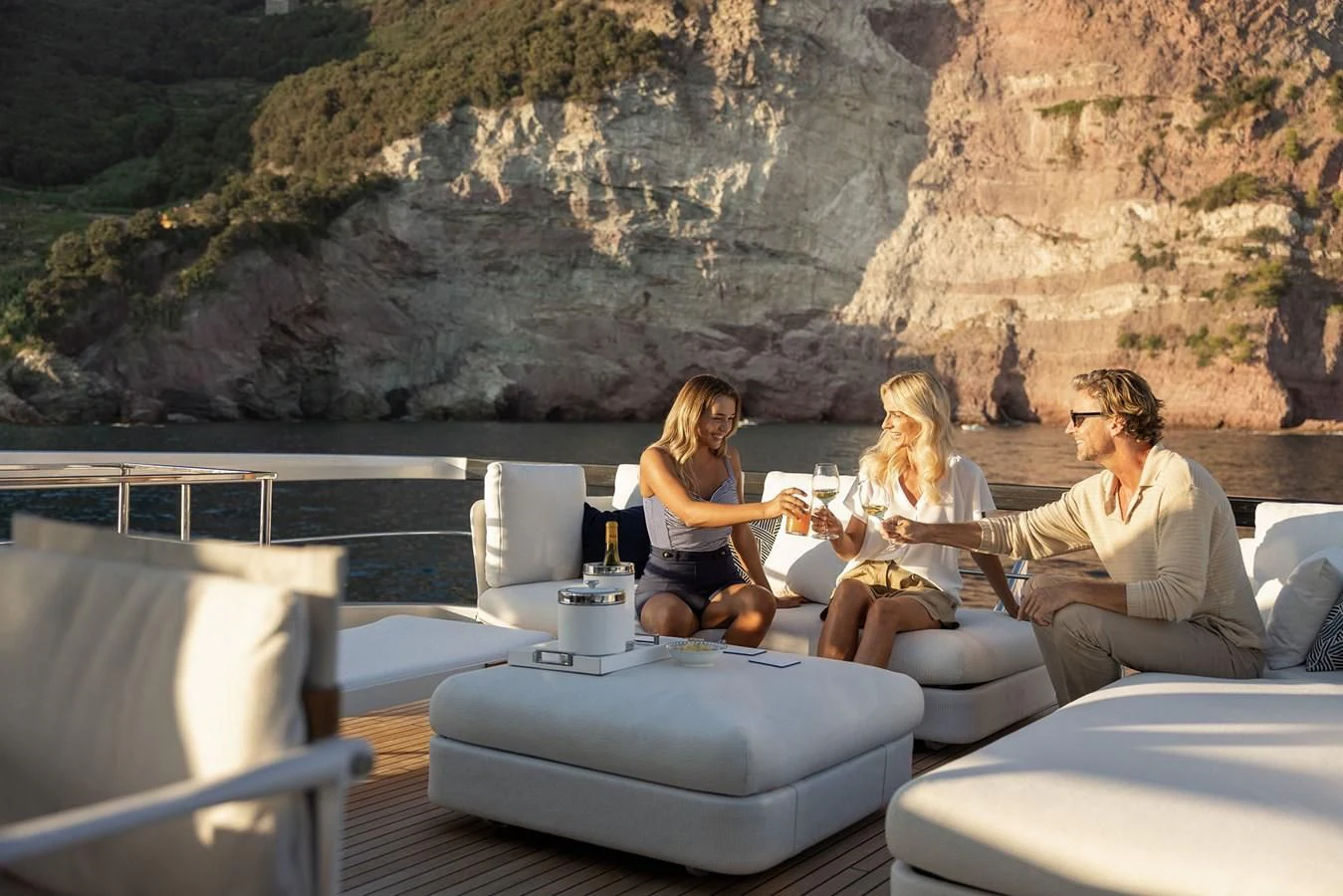a group of people sitting on a couch aboard ALEGRA Yacht for Sale
