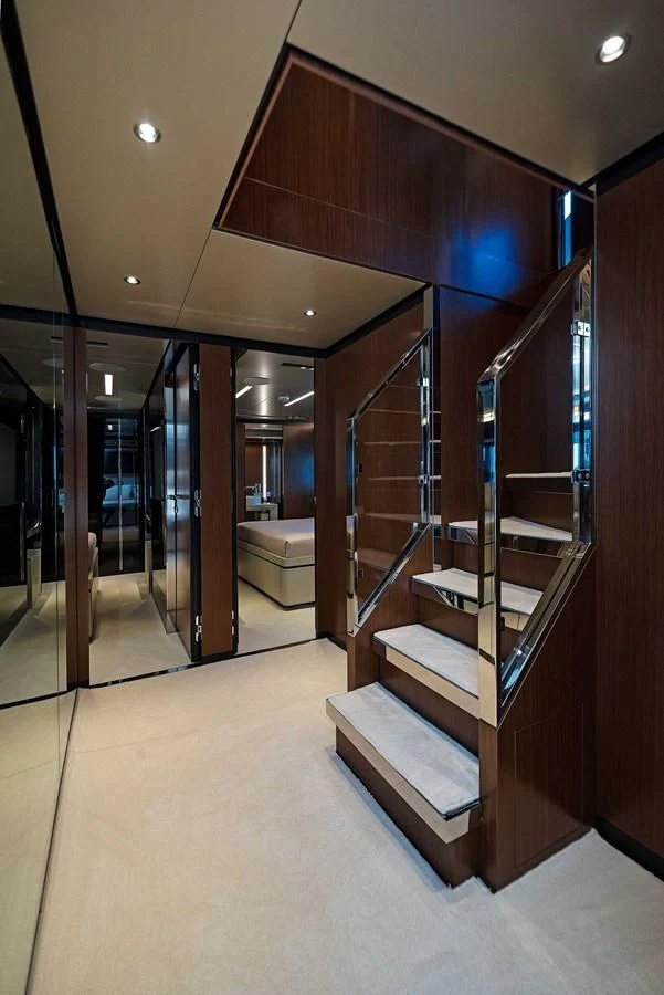 a large room with a set of stairs and a glass door aboard ALEGRA Yacht for Sale