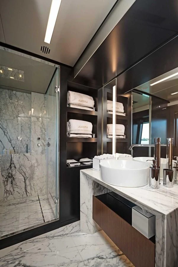 a bathroom with a sink and a mirror aboard ALEGRA Yacht for Sale