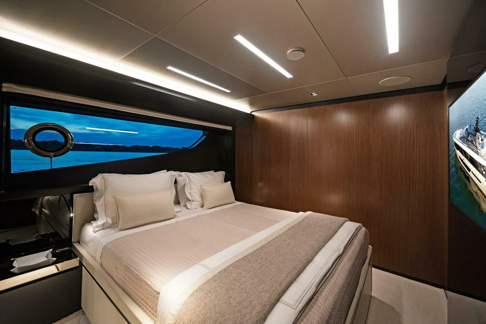 a bed with a white sheet and a blue screen above it aboard ALEGRA Yacht for Sale