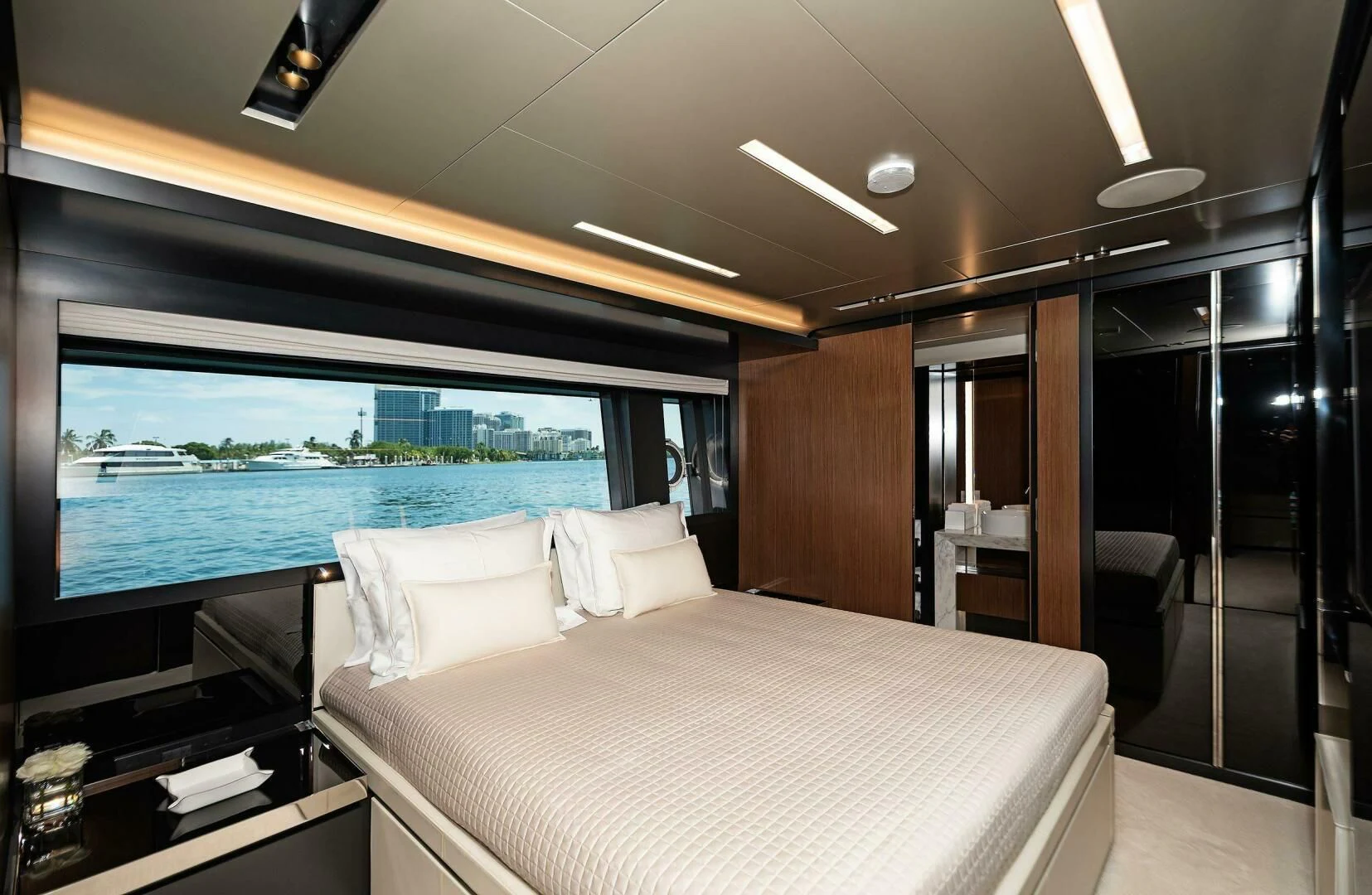 a room with a bed and a large window aboard ALEGRA Yacht for Sale