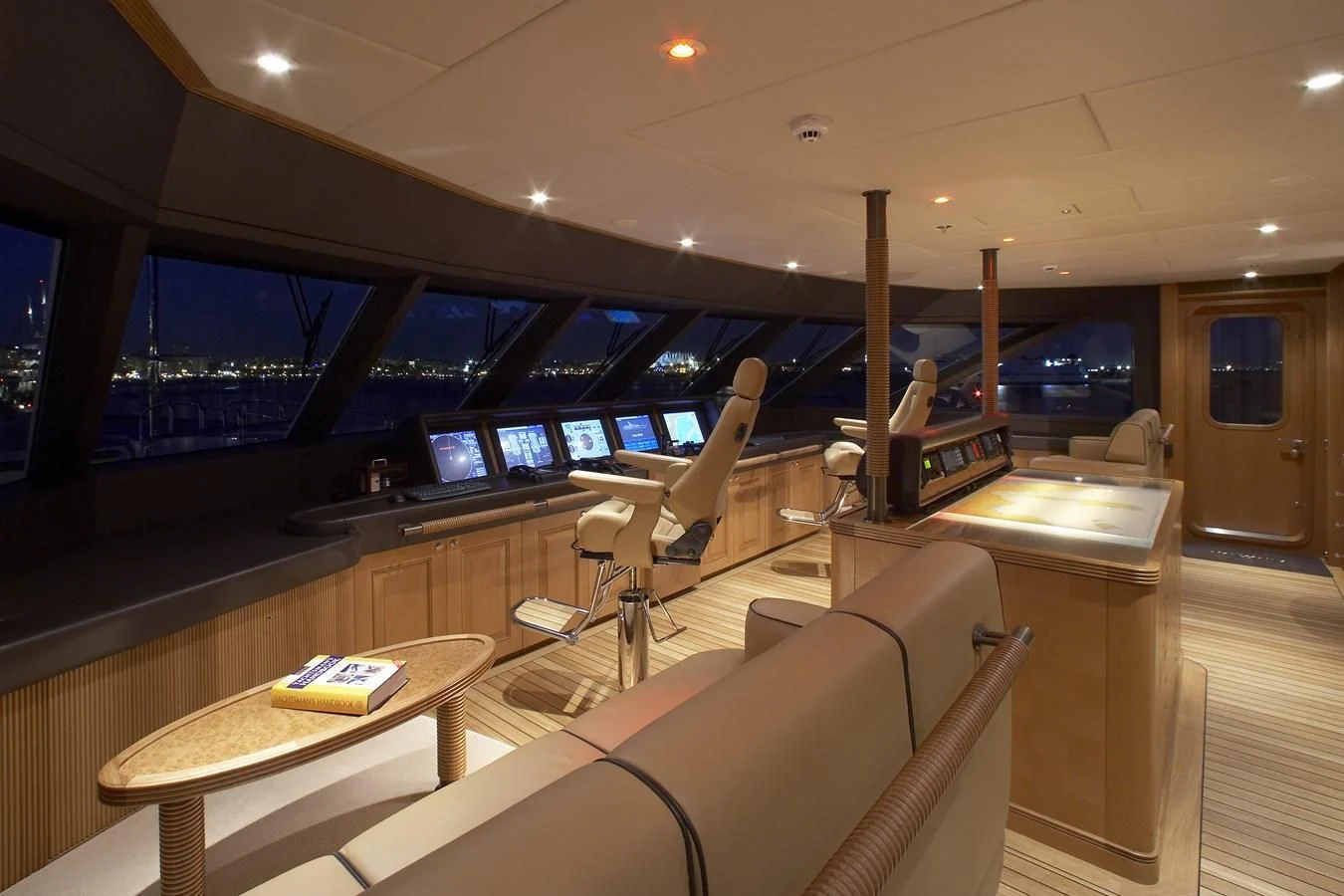 a room with a desk and chairs aboard NECTAR Yacht for Sale