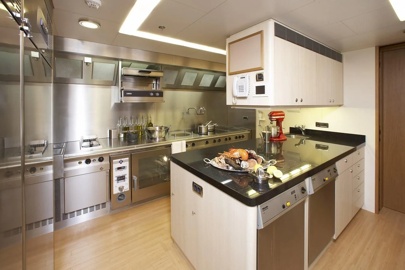 a kitchen with a large island aboard NECTAR Yacht for Sale