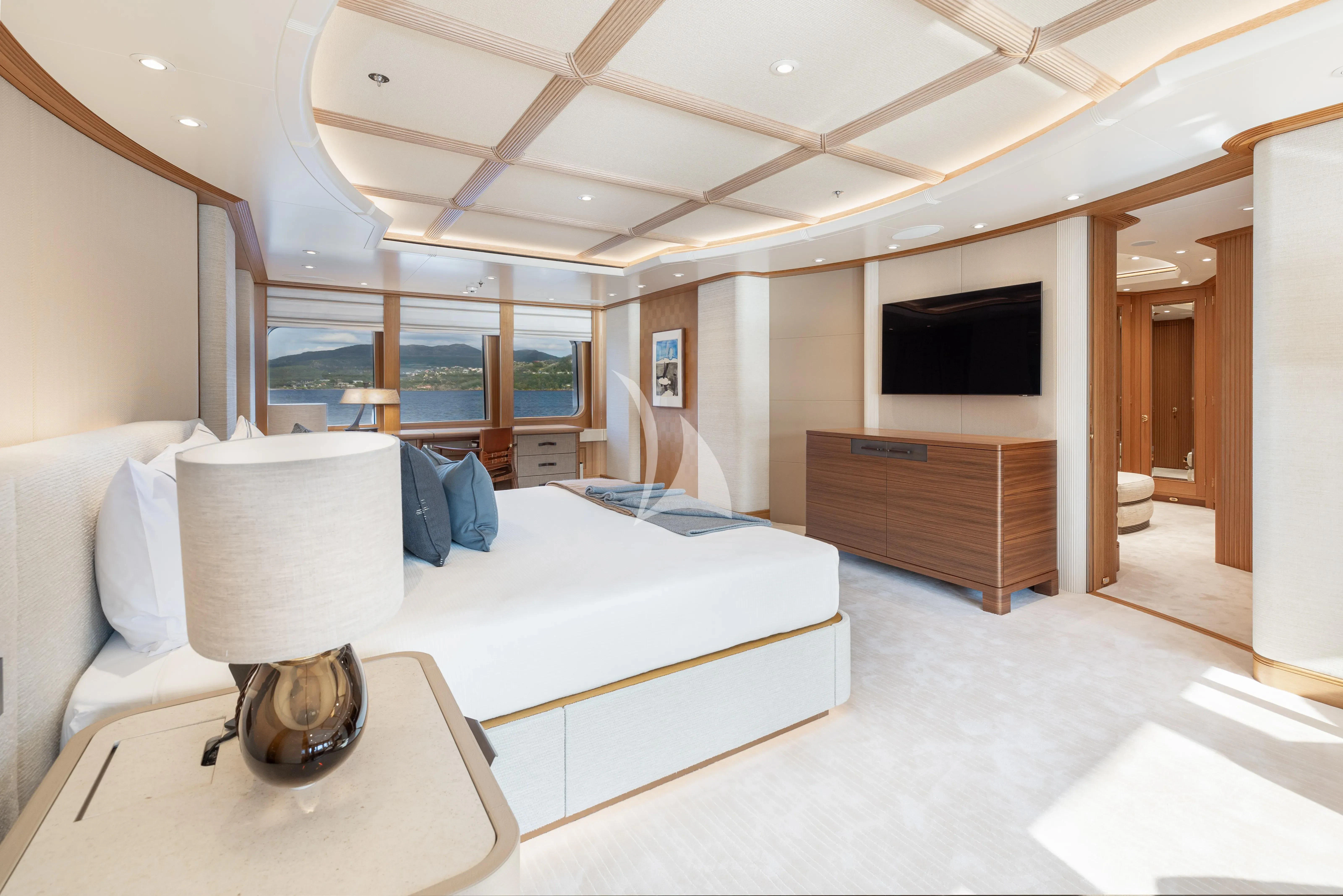 a room with a bed and a television aboard NECTAR Yacht for Sale