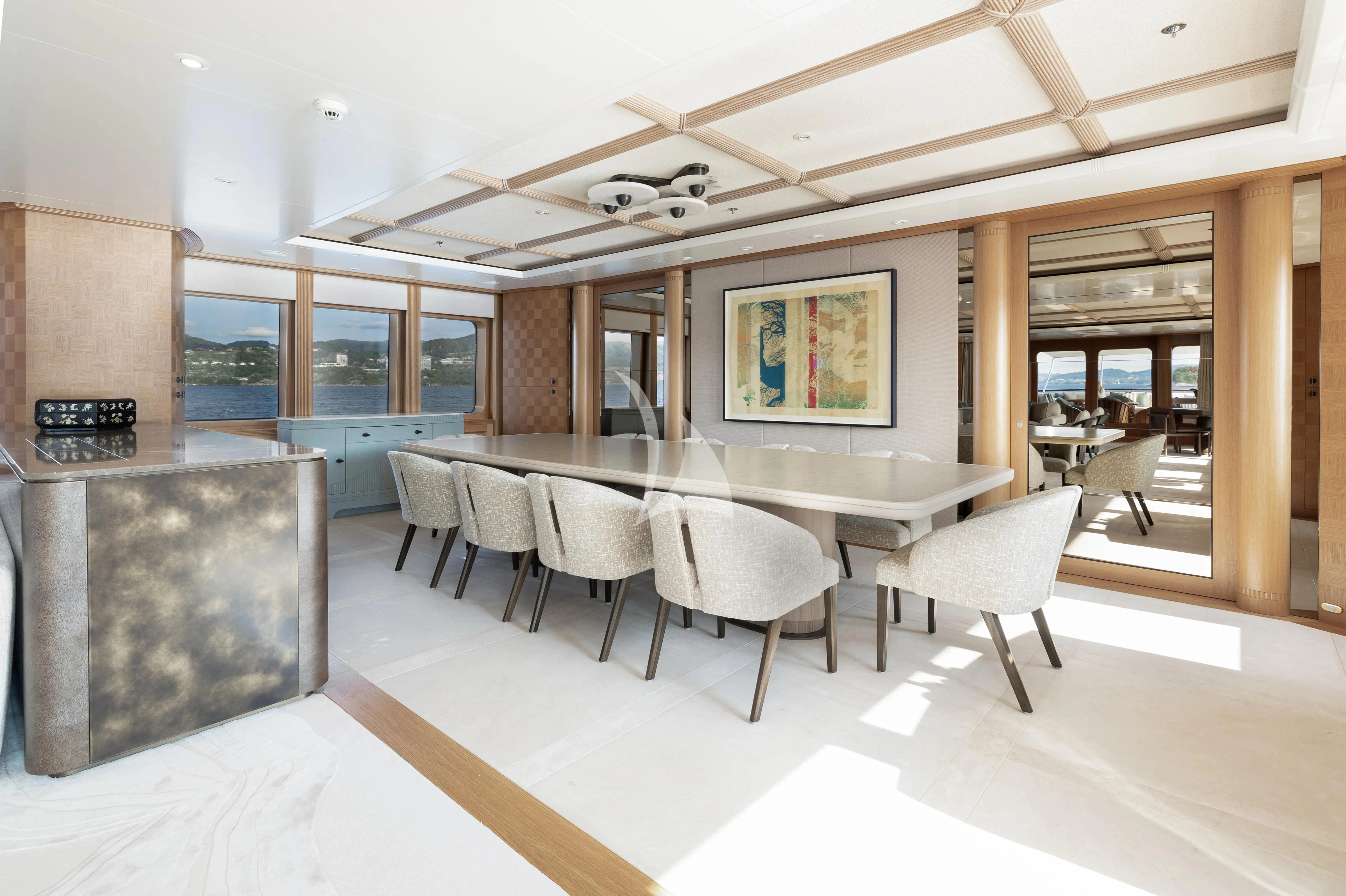 a large kitchen with a table and chairs aboard NECTAR Yacht for Sale