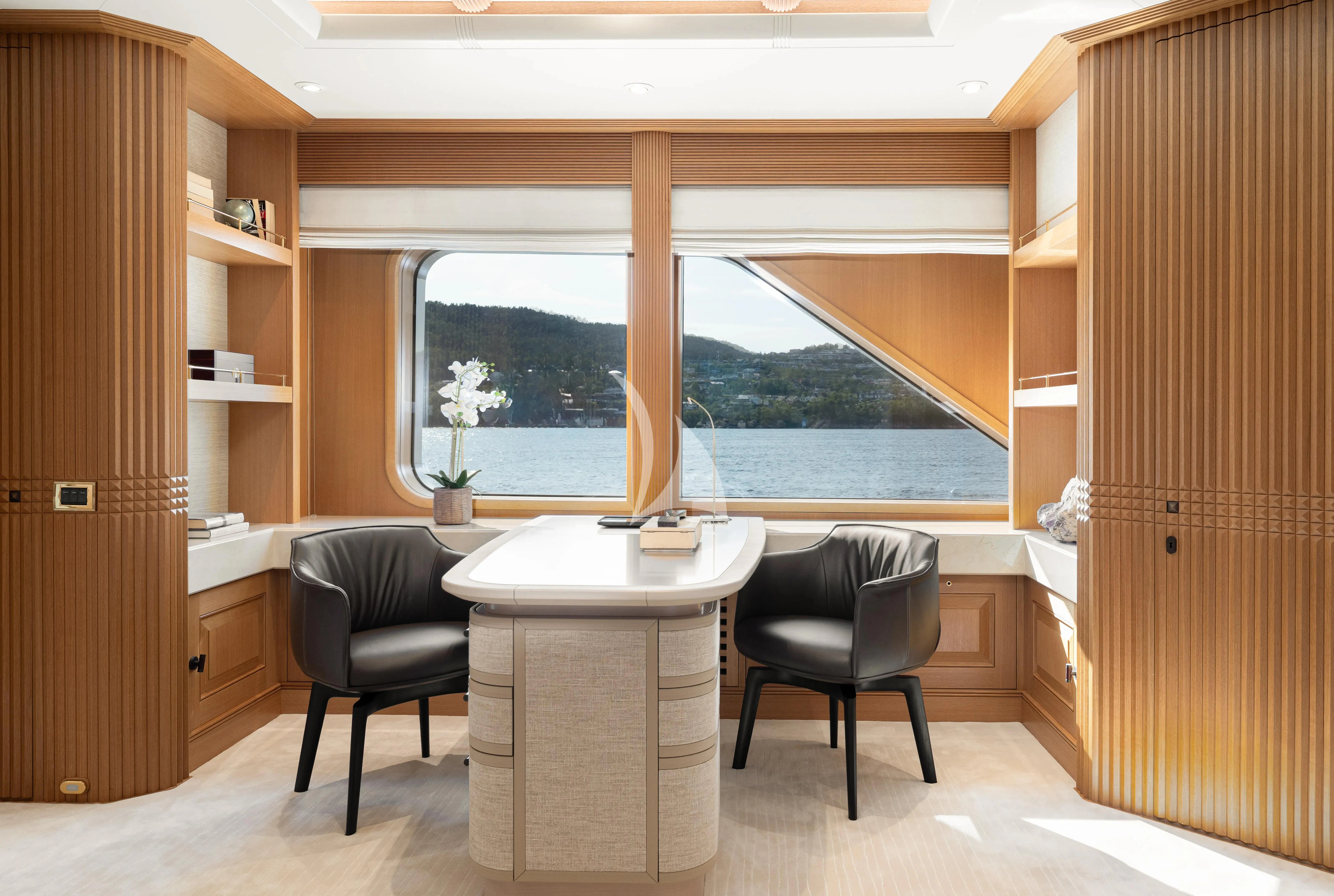 a room with a table and chairs aboard NECTAR Yacht for Sale