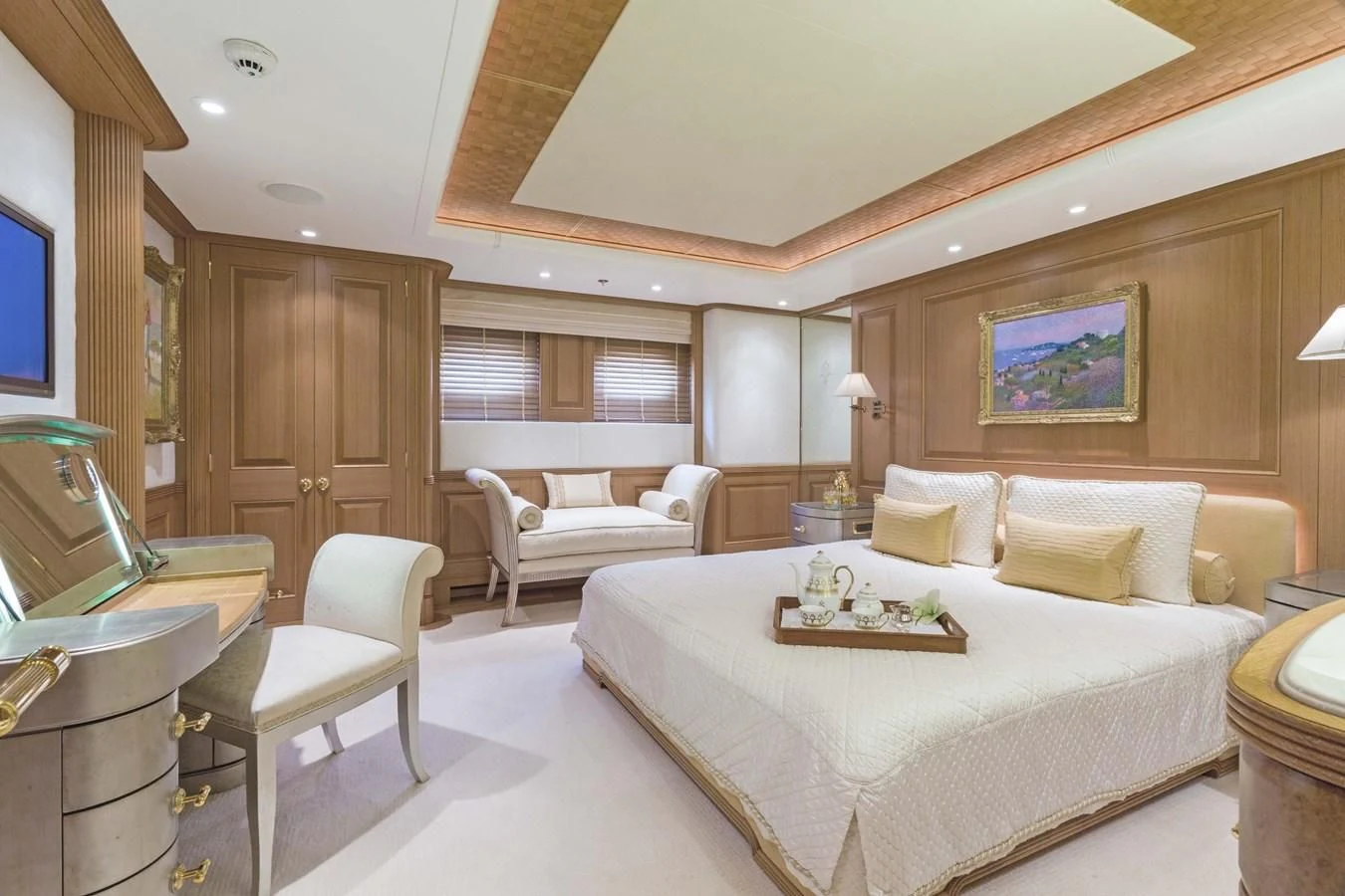 a large bedroom with a bed and a couch aboard NECTAR Yacht for Sale