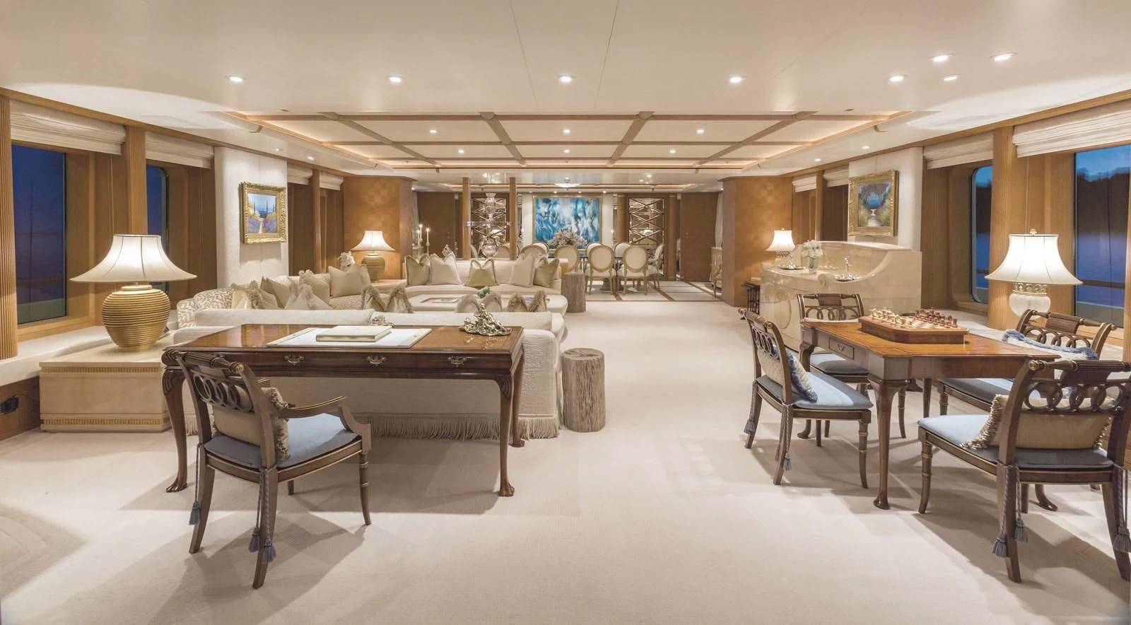a large room with tables and chairs aboard NECTAR Yacht for Sale