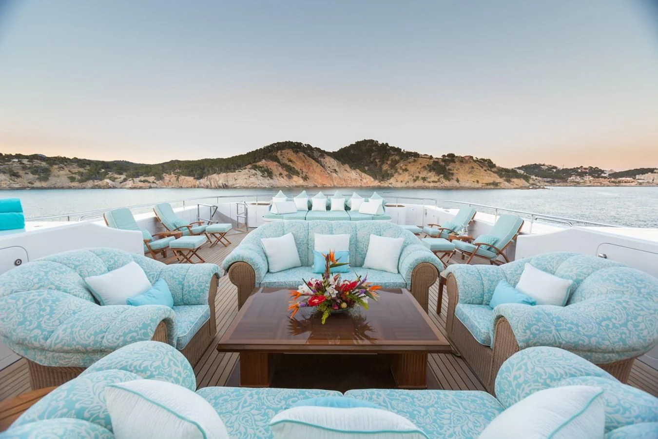 a large lounge area with chairs and a table on it aboard NECTAR Yacht for Sale
