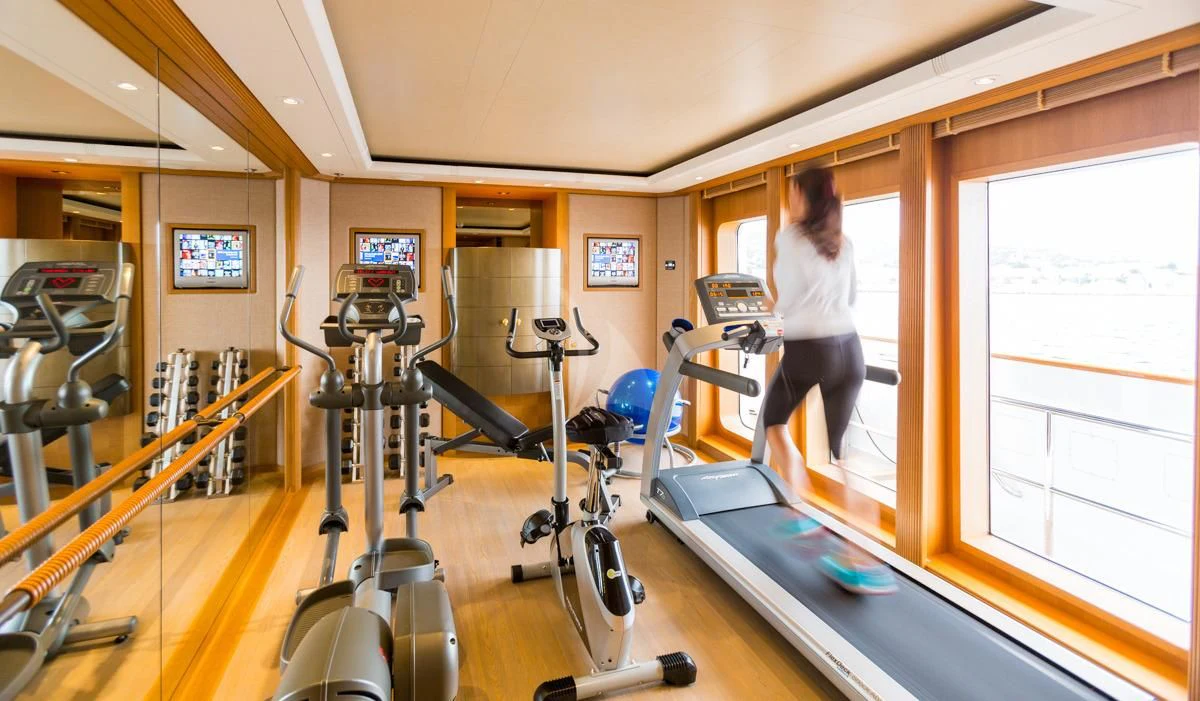 a person working out in a gym aboard NECTAR Yacht for Sale