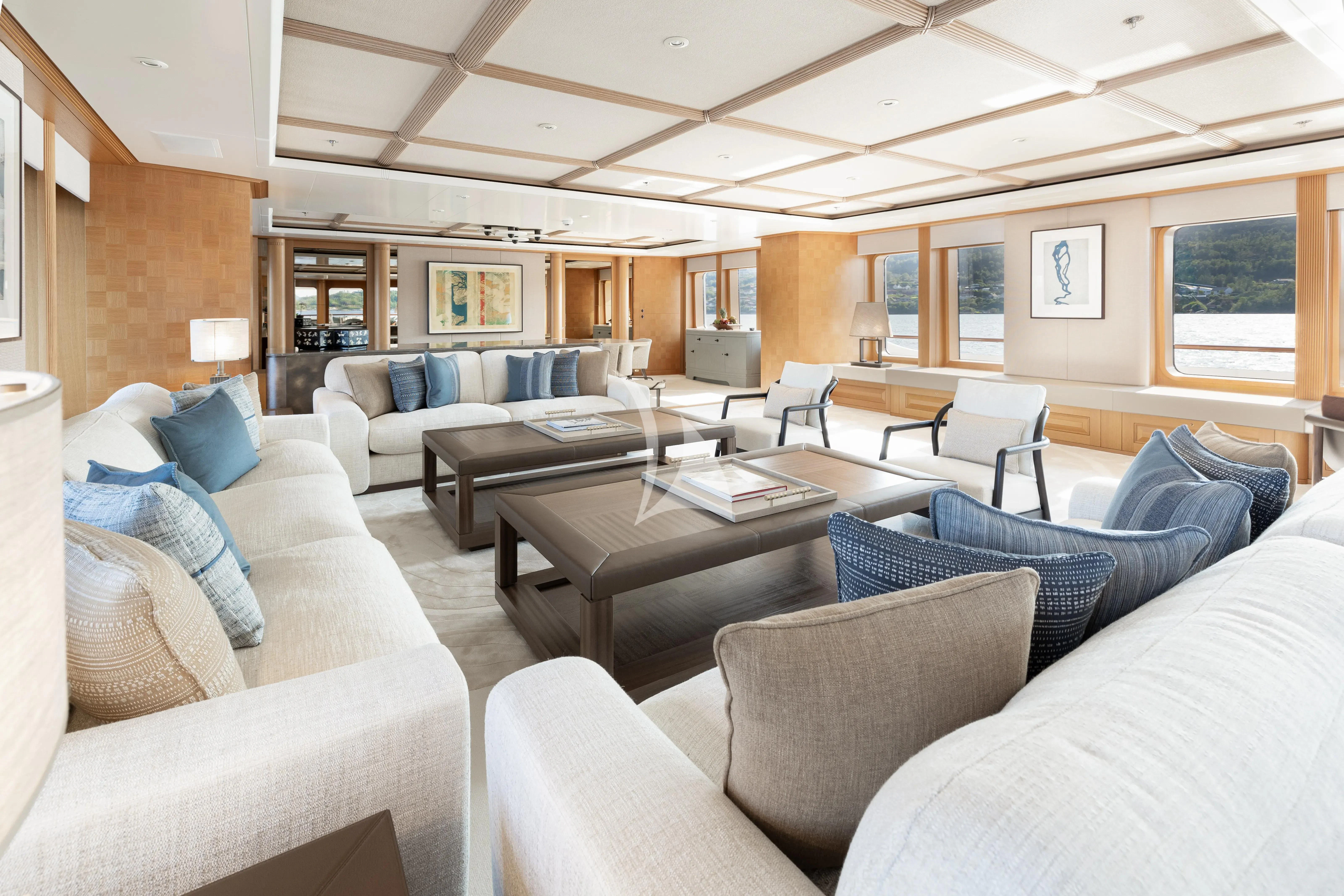 a living room with a couch and a table aboard NECTAR Yacht for Sale