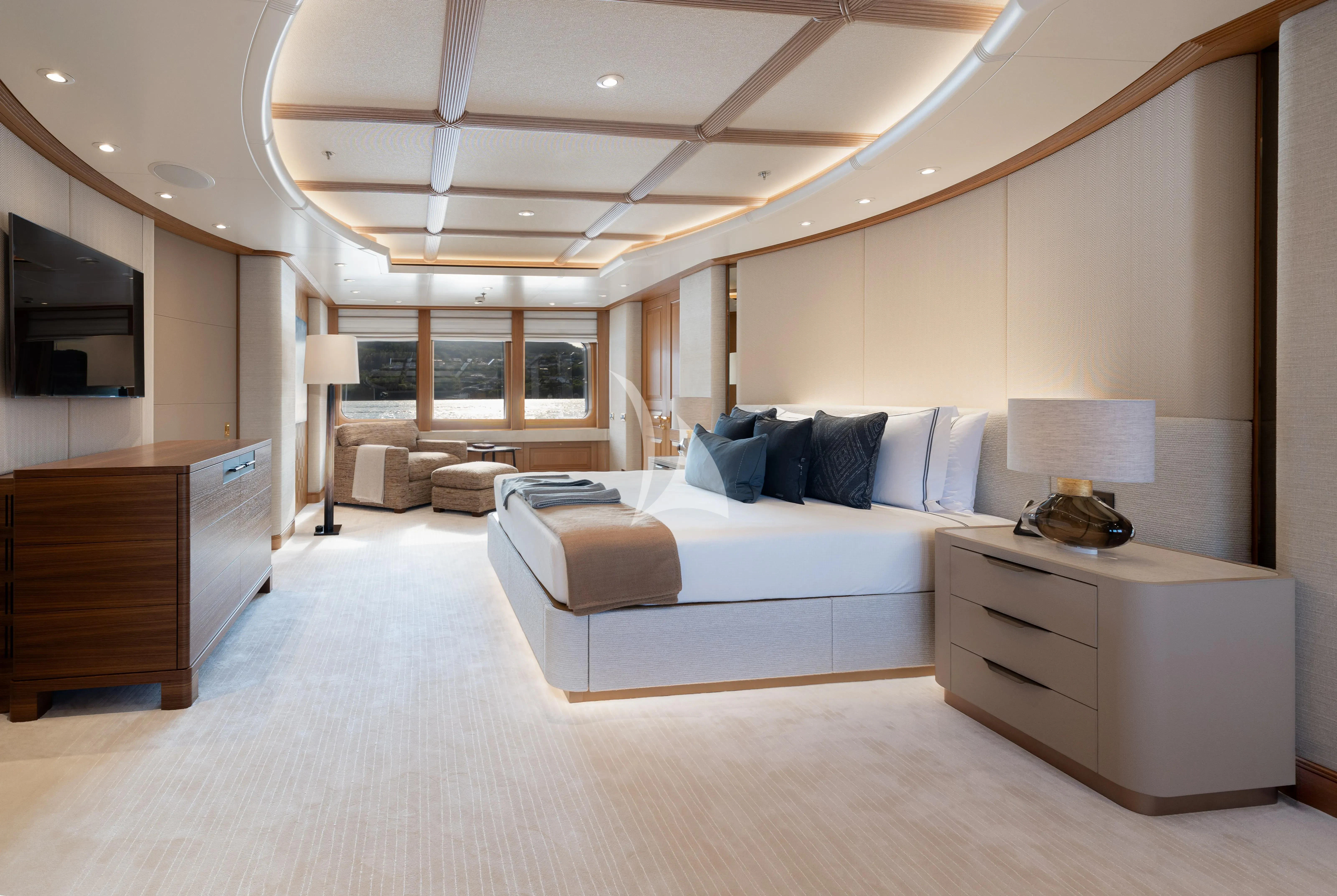 a large living room with a large bed and a large window aboard NECTAR Yacht for Sale