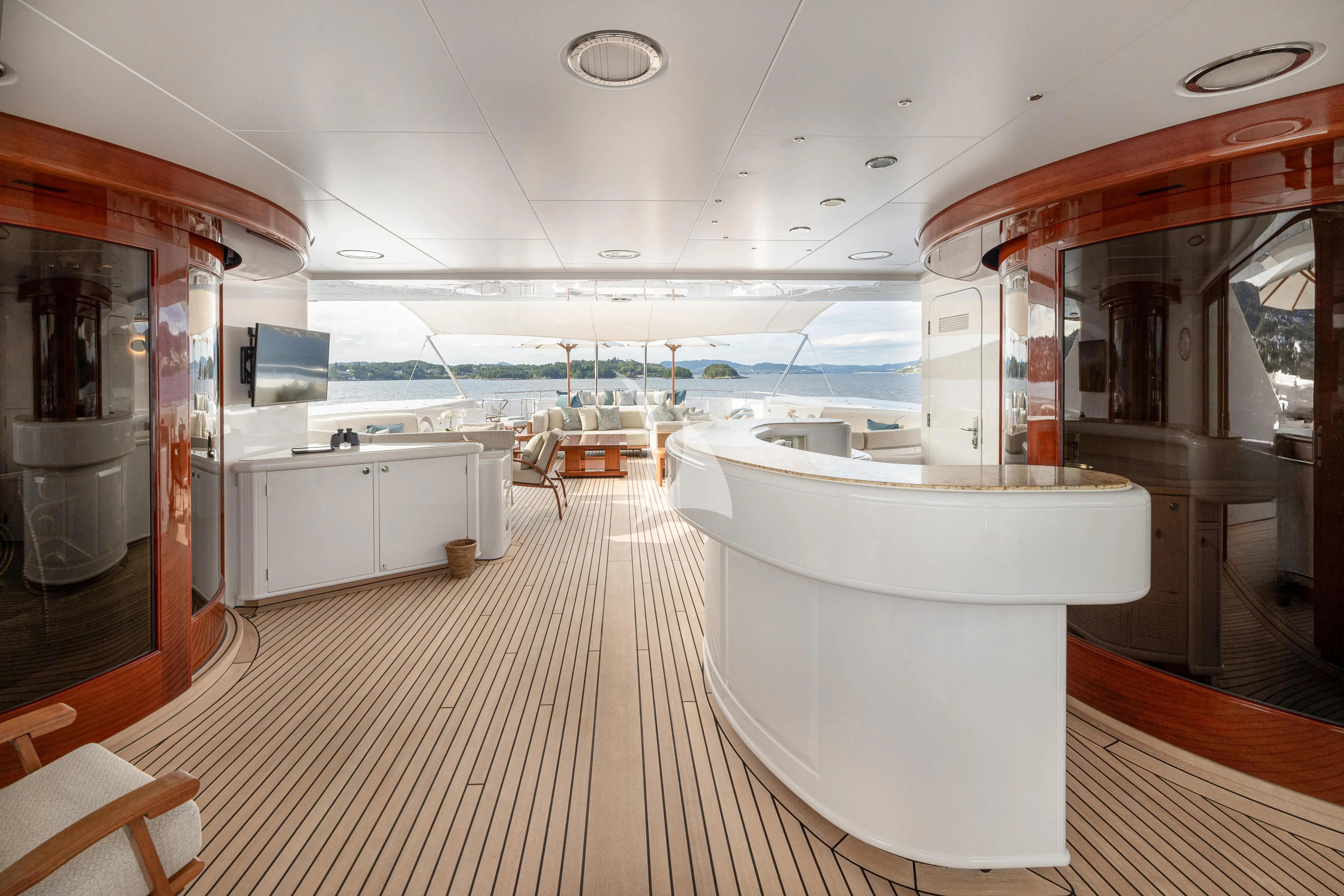 a large white bathtub in a room with a large window aboard NECTAR Yacht for Sale