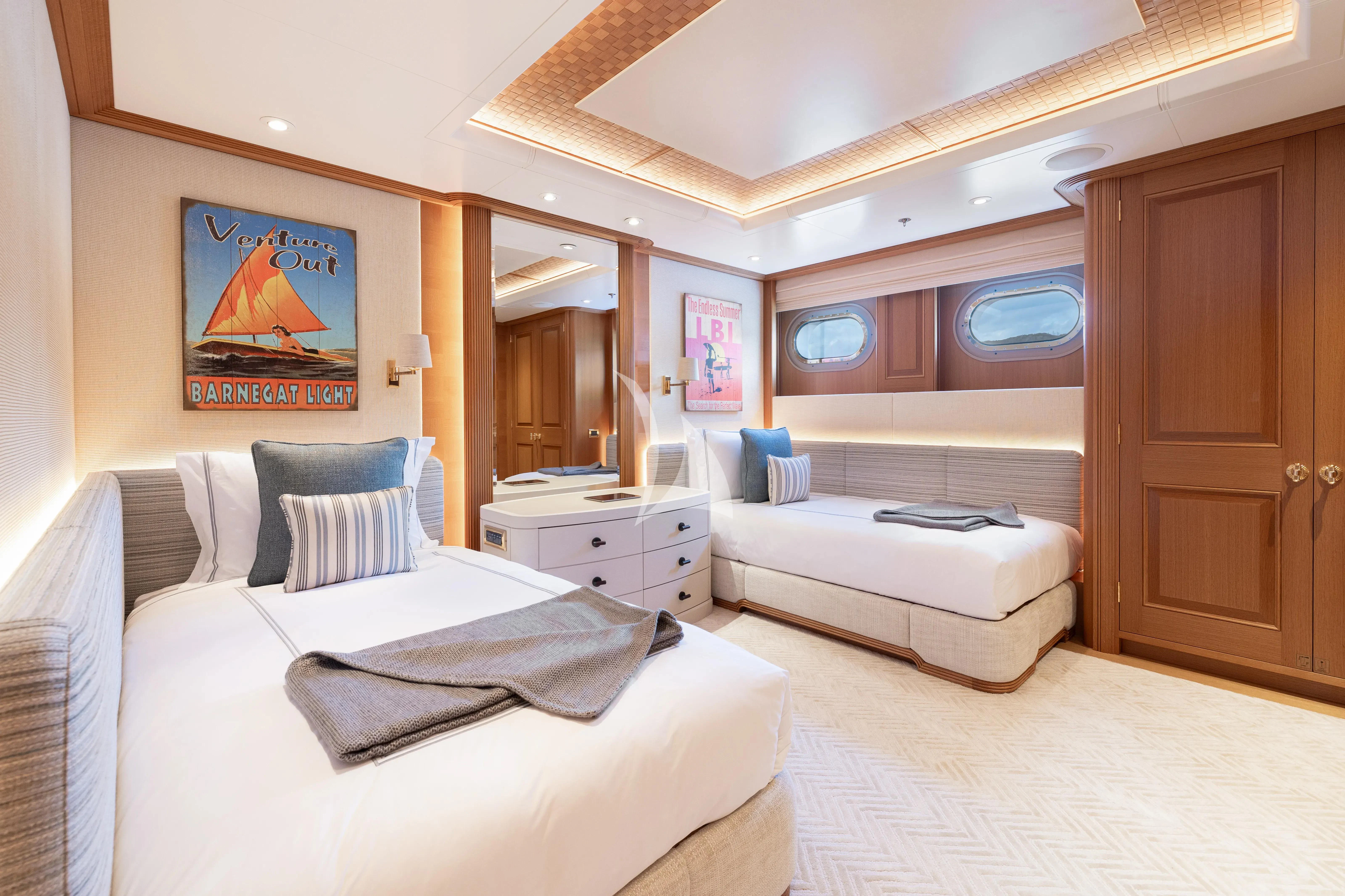 a bedroom with a bed and a couch aboard NECTAR Yacht for Sale