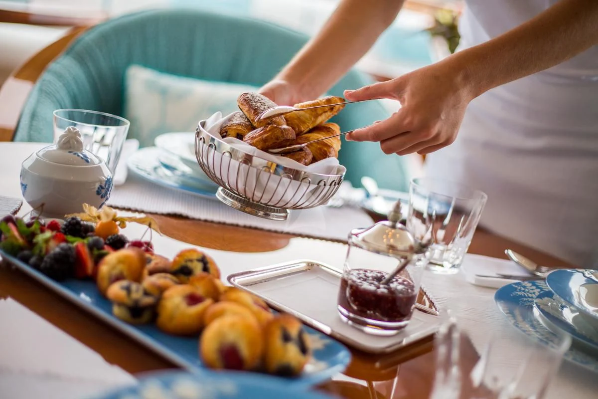 a person eating food aboard NECTAR Yacht for Sale