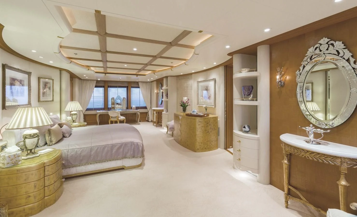 a large bedroom with a large mirror aboard NECTAR Yacht for Sale