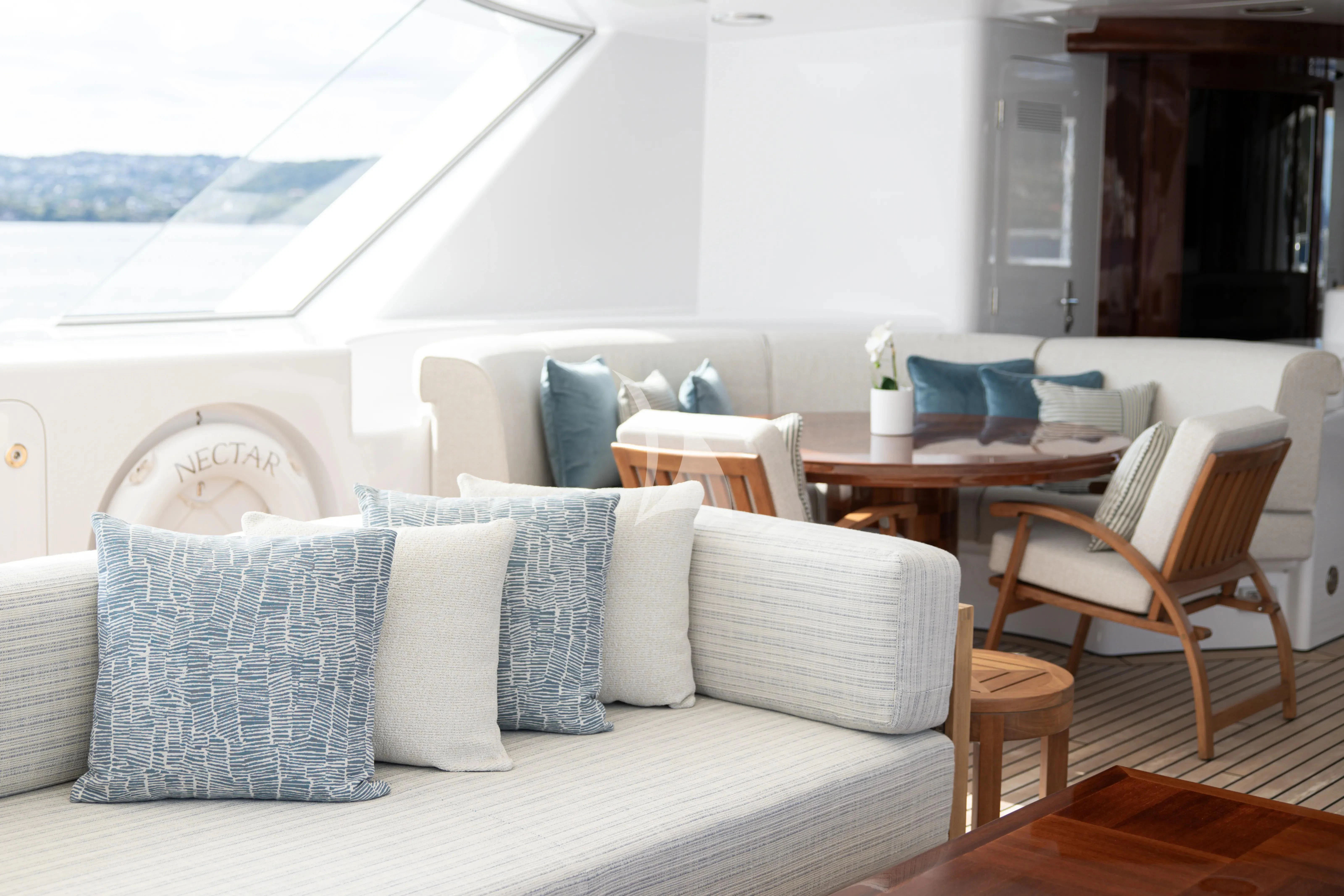 a living room with a couch and chairs aboard NECTAR Yacht for Sale