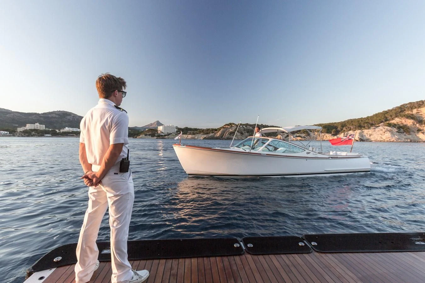 a man standing on a boat aboard NECTAR Yacht for Sale