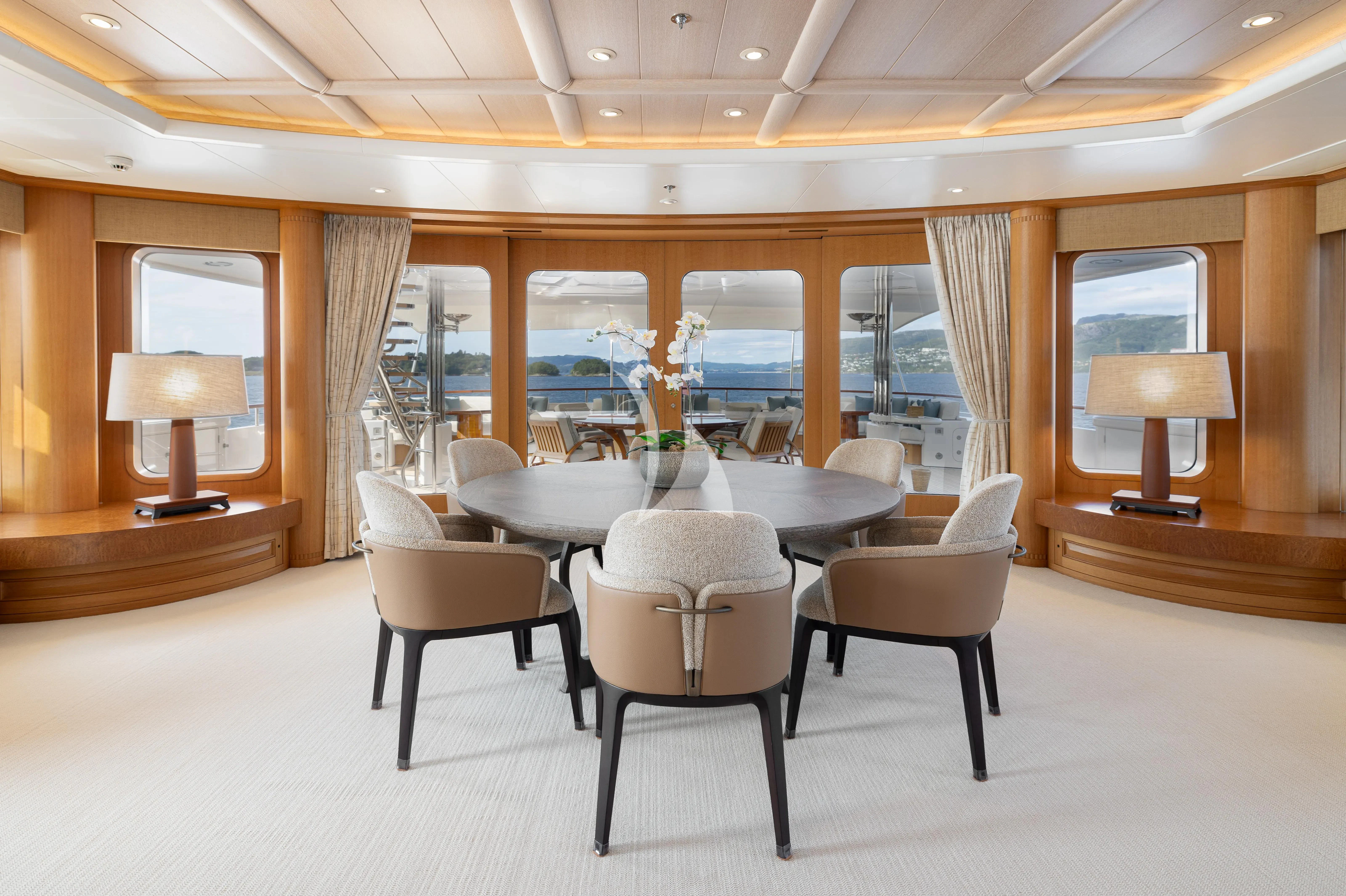 a room with a table and chairs aboard NECTAR Yacht for Sale
