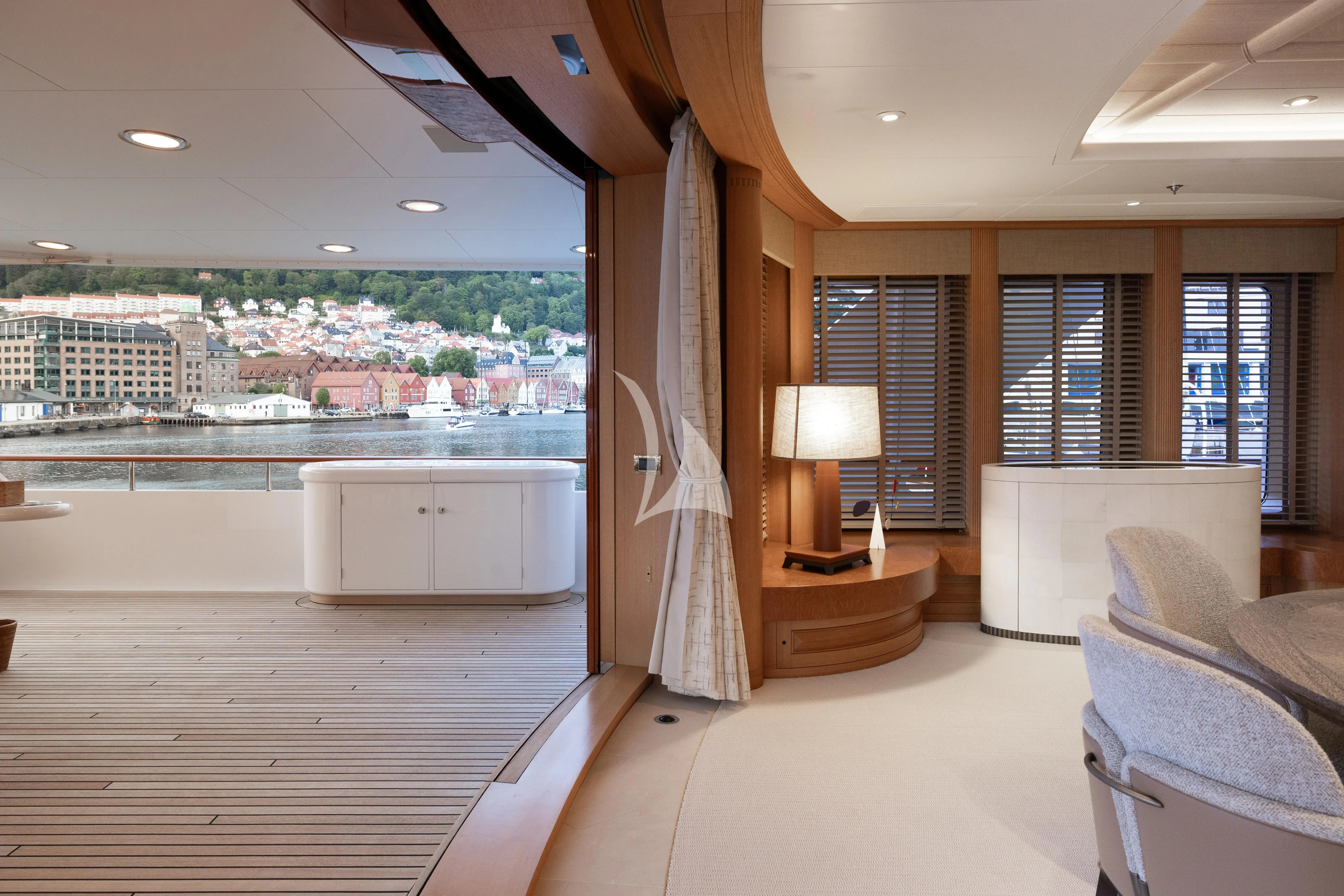 a room with a couch and a table and a window aboard NECTAR Yacht for Sale