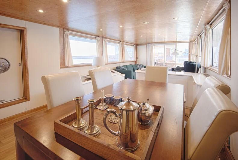 a table with candles on it aboard MARAM Yacht for Sale