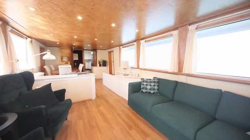 a living room with a couch and a table aboard MARAM Yacht for Sale