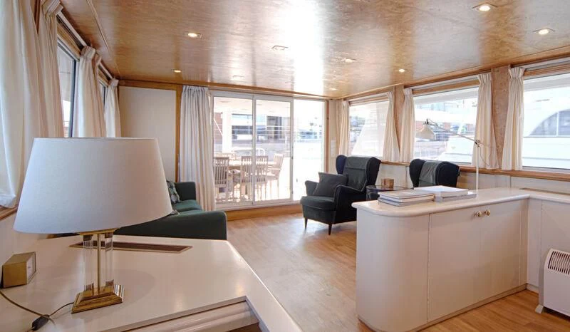 a room with a lamp and a couch aboard MARAM Yacht for Sale