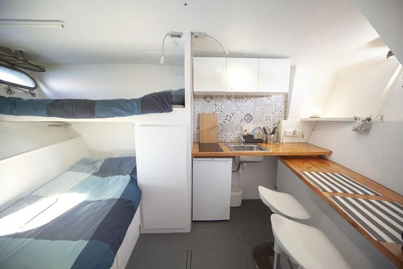a small kitchen with a bed aboard MARAM Yacht for Sale