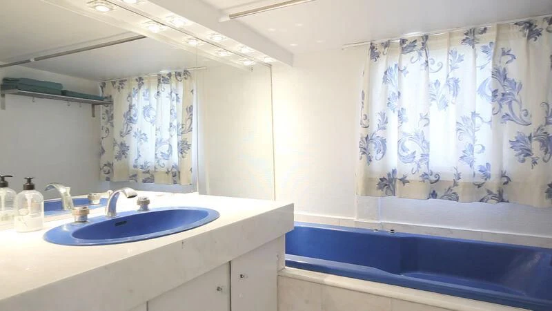 a bathroom with a bathtub sink and a sink aboard MARAM Yacht for Sale