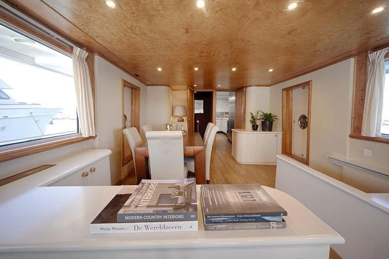 a large room with a table and chairs aboard MARAM Yacht for Sale