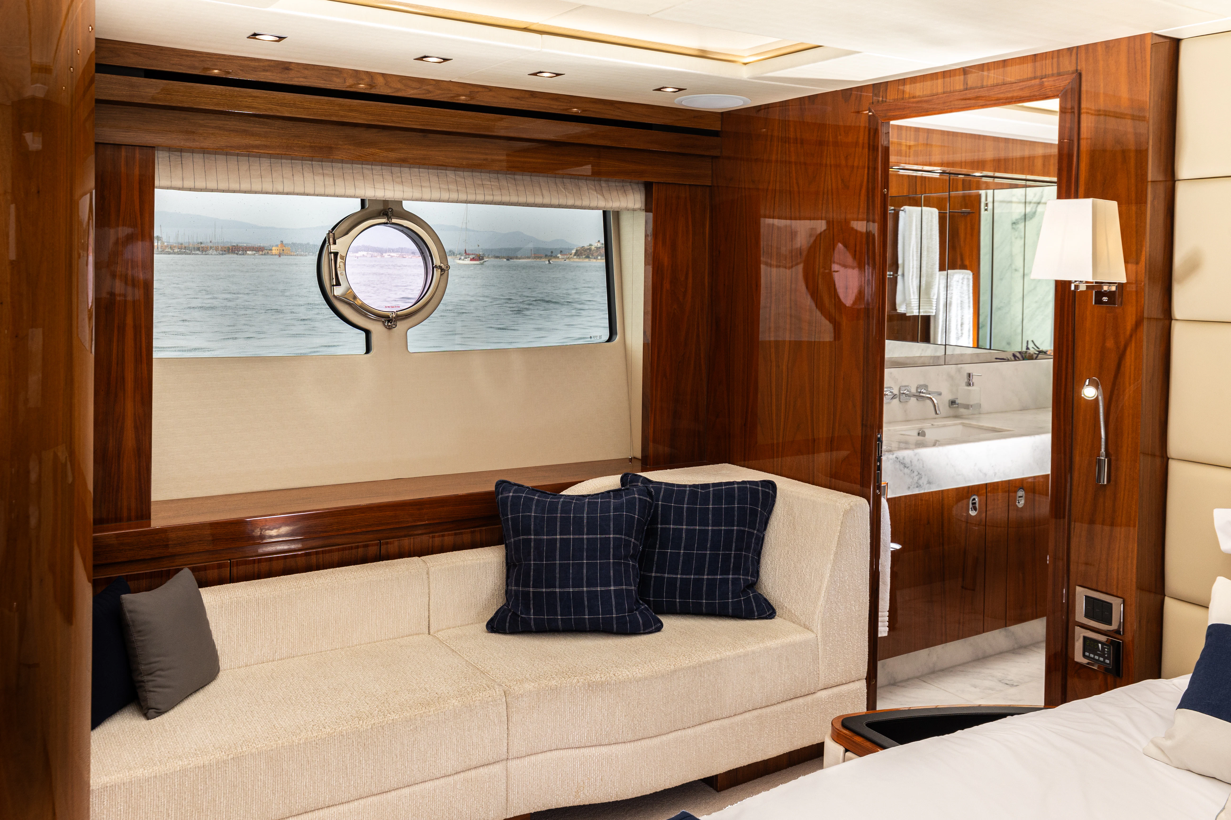 a room with a bed and a mirror aboard STARDUST OF MARY Yacht for Sale