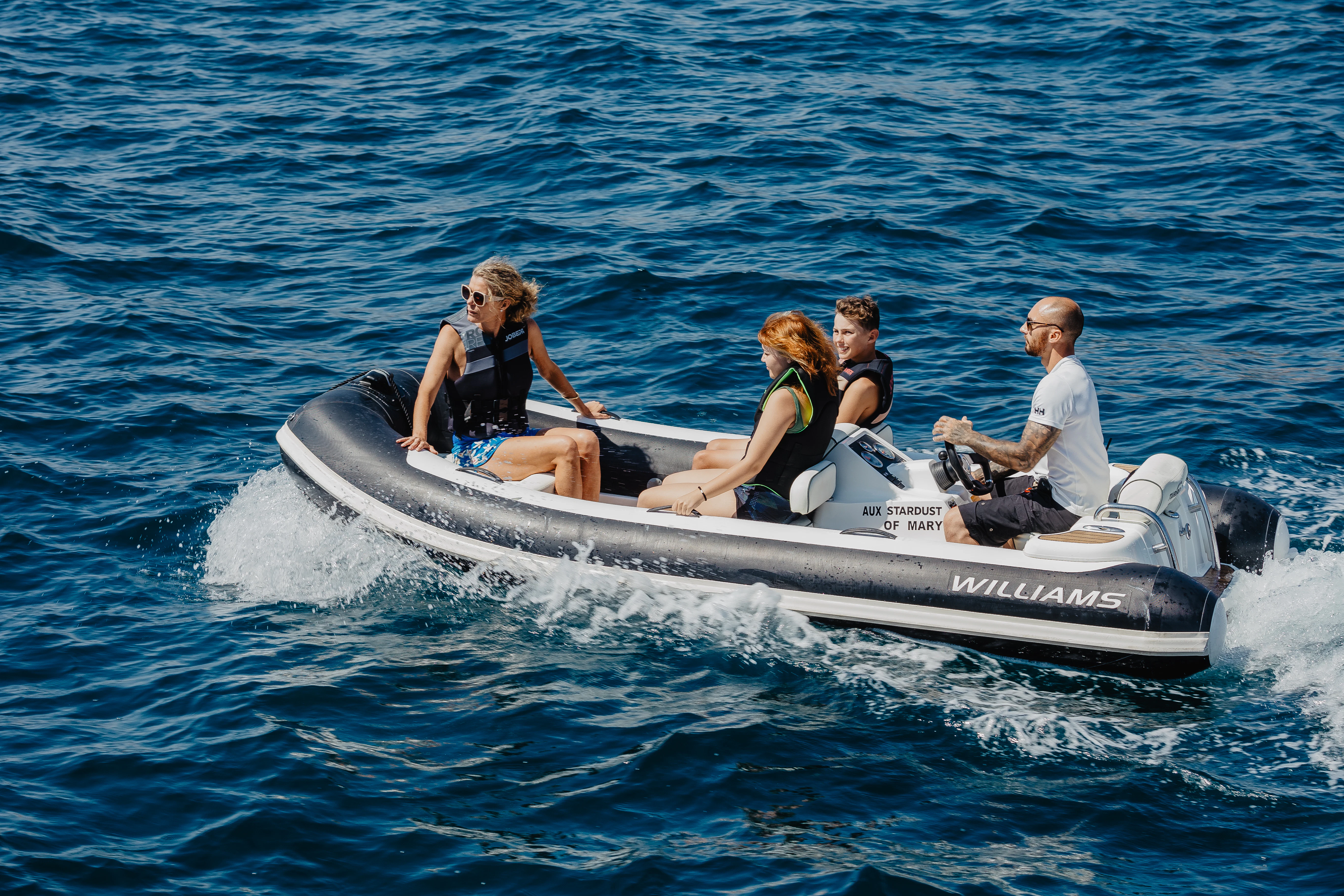 a group of people on a boat aboard STARDUST OF MARY Yacht for Sale