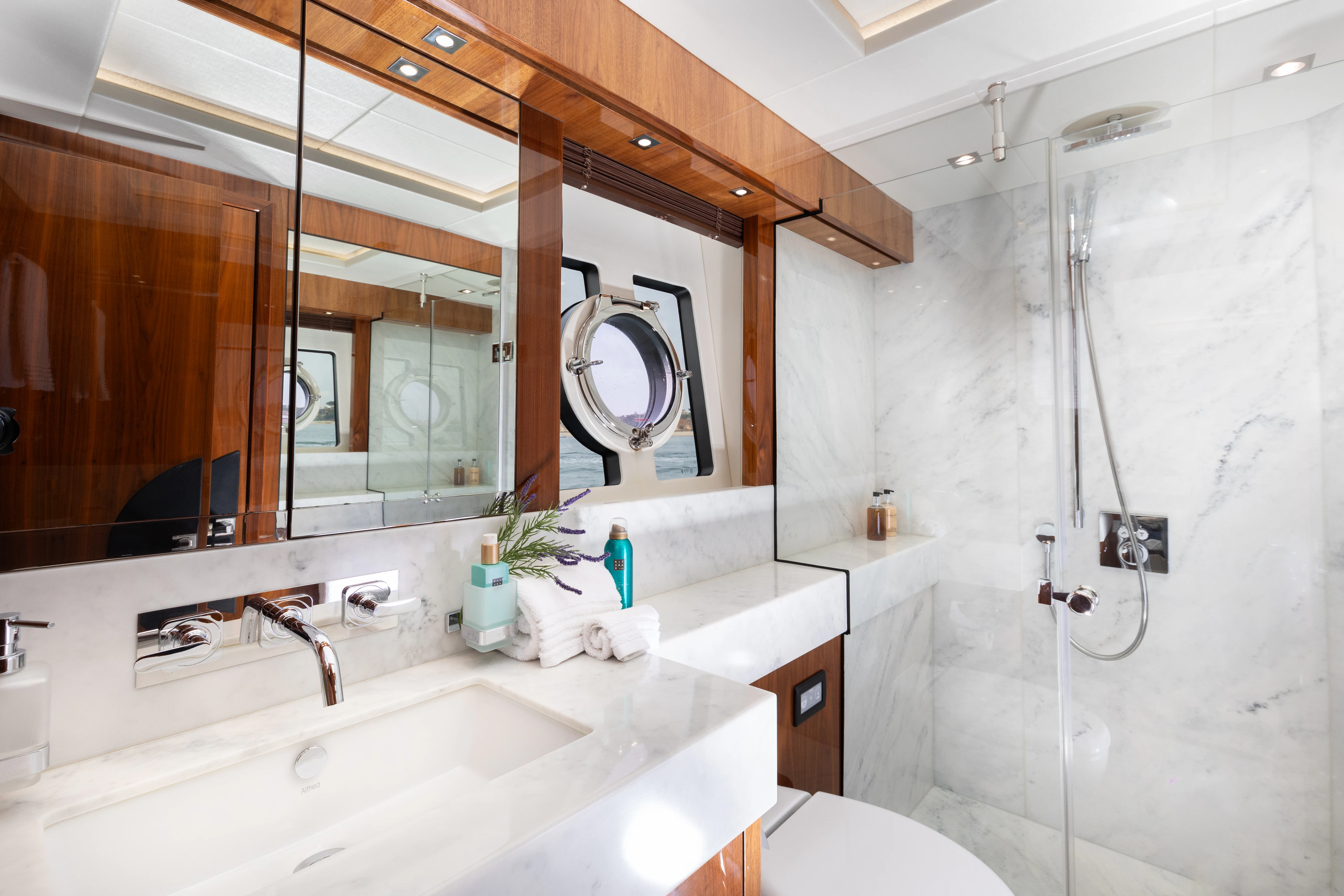 a bathroom with a large mirror aboard STARDUST OF MARY Yacht for Sale