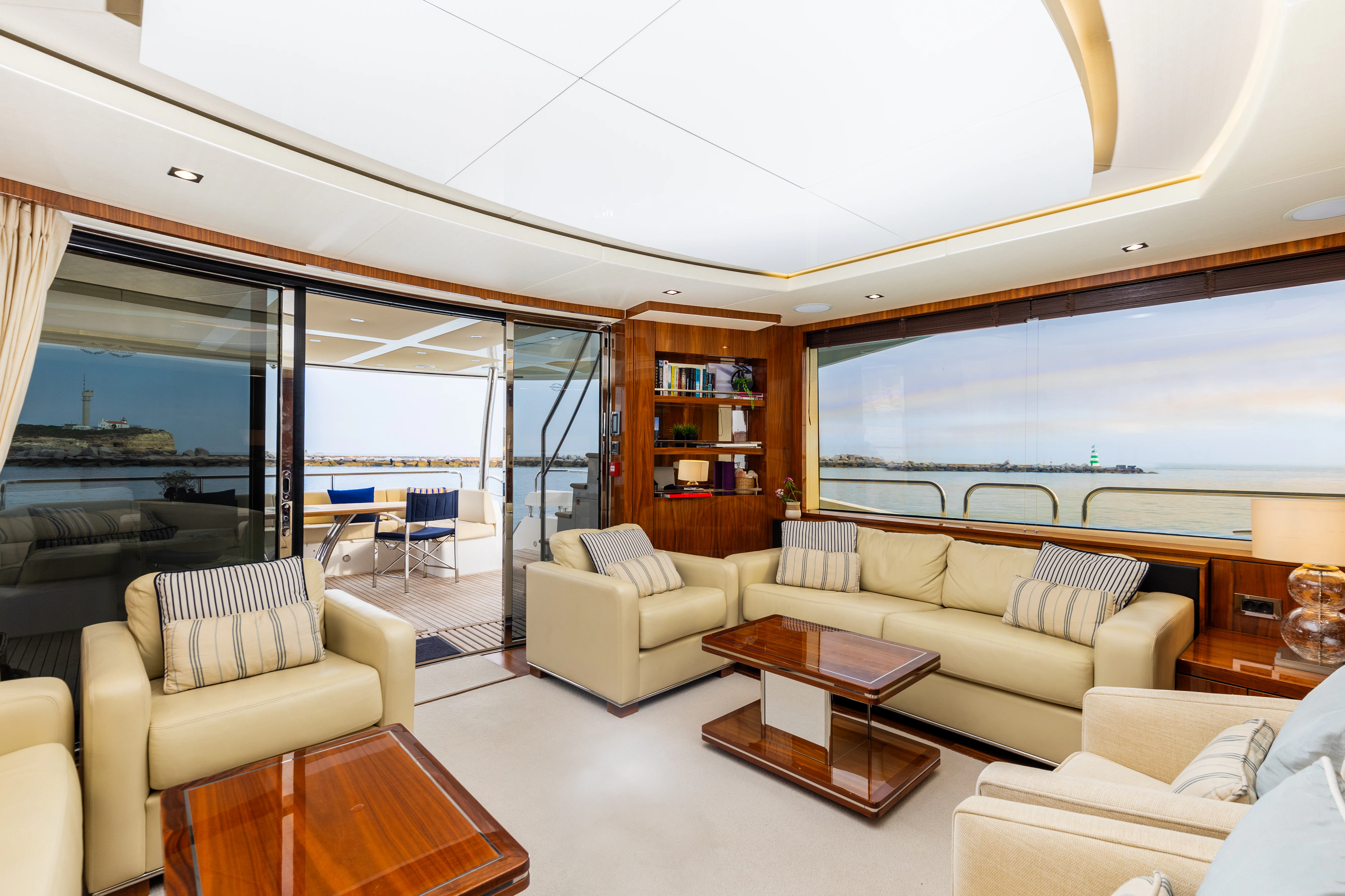 a living room with a large window aboard STARDUST OF MARY Yacht for Sale