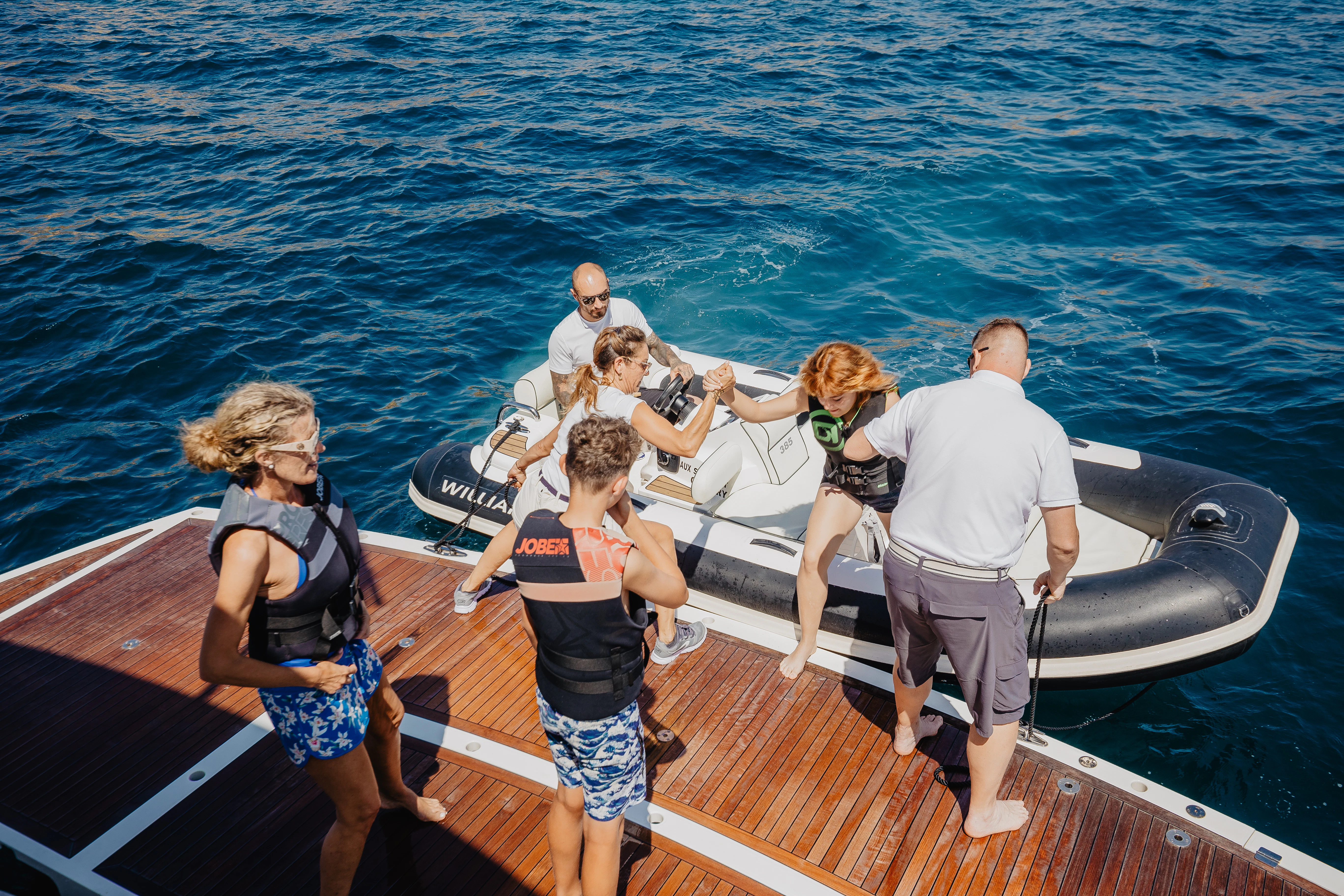 a group of people on a boat aboard STARDUST OF MARY Yacht for Sale