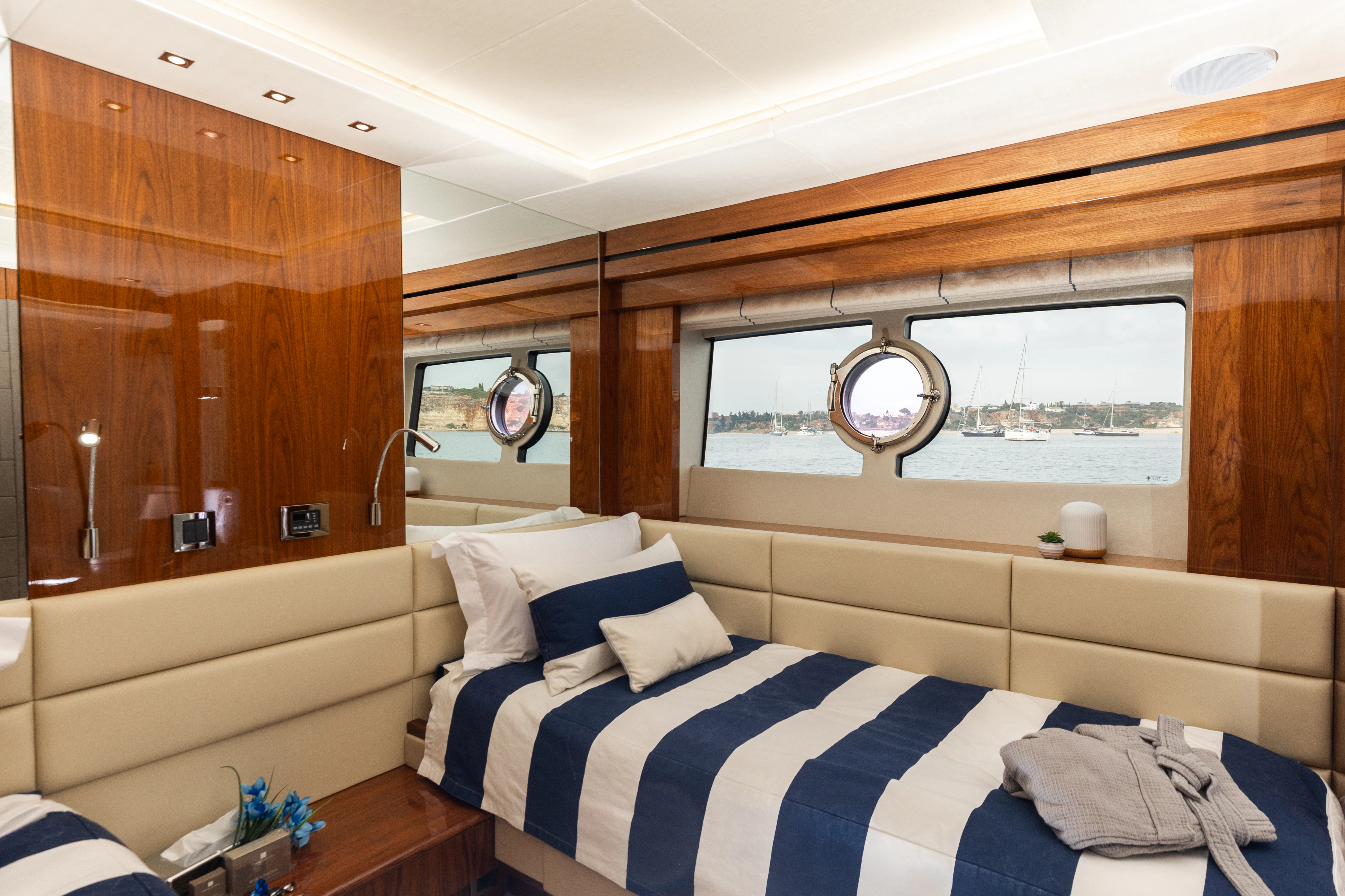 a room with a bed and a window aboard STARDUST OF MARY Yacht for Sale