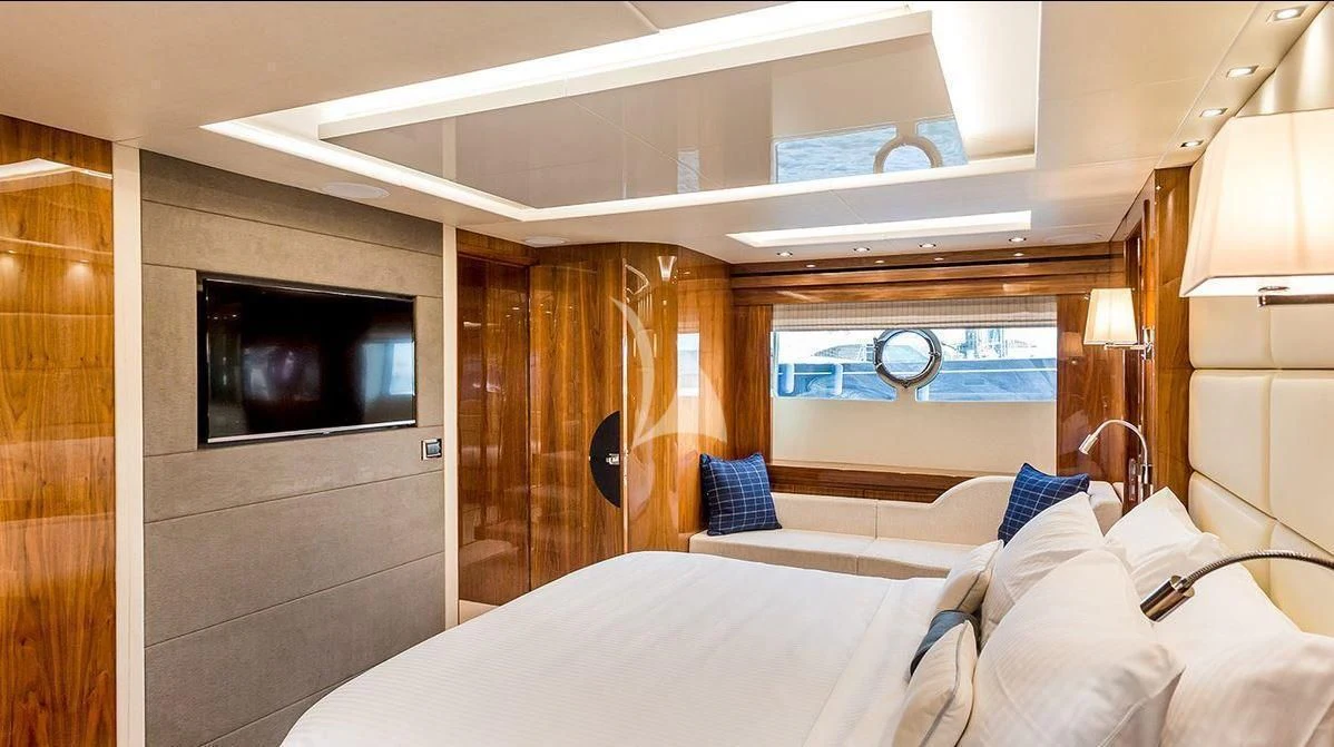 a room with a bed and a television aboard STARDUST OF MARY Yacht for Sale