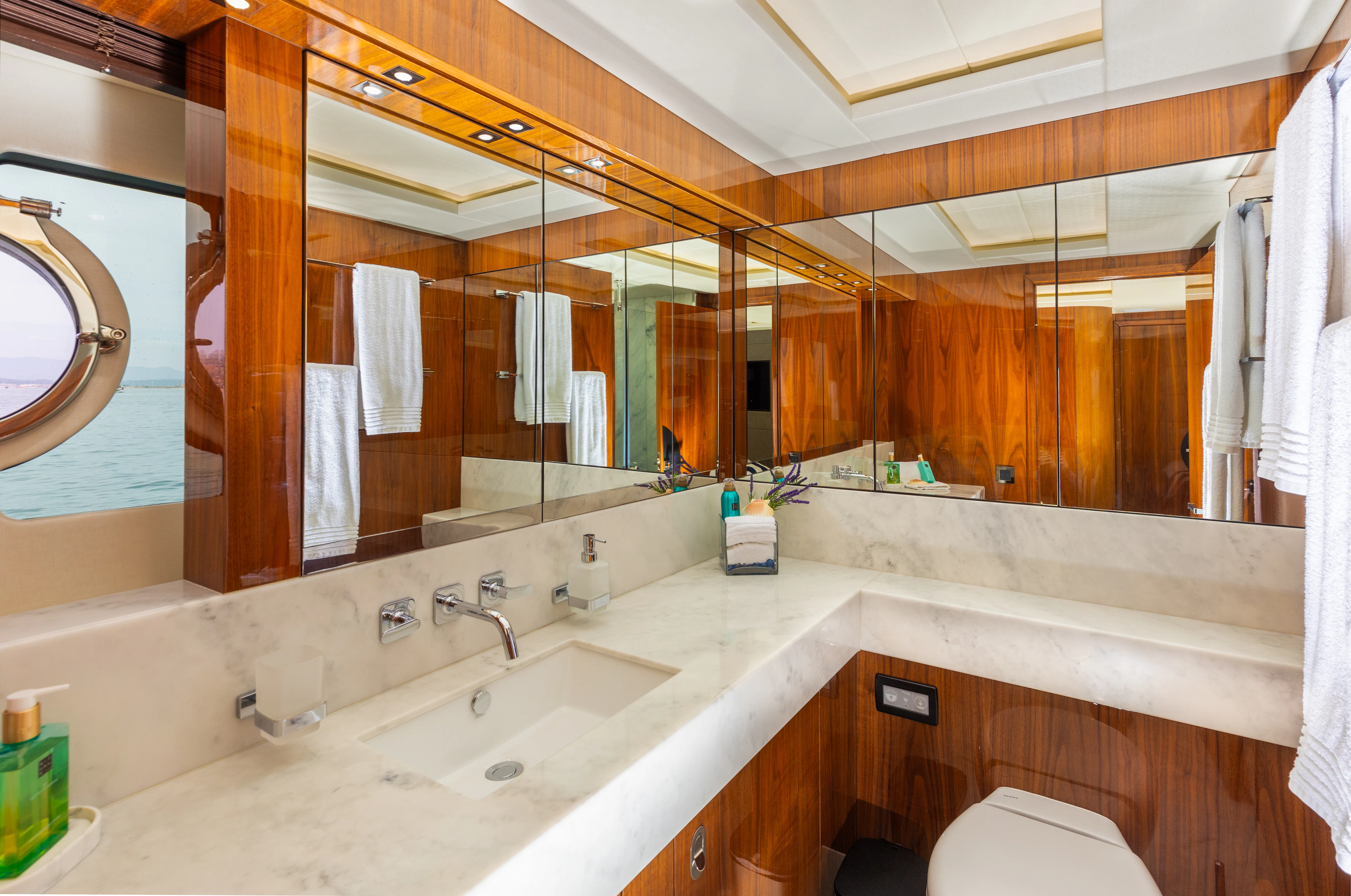 a bathroom with a large mirror aboard STARDUST OF MARY Yacht for Sale