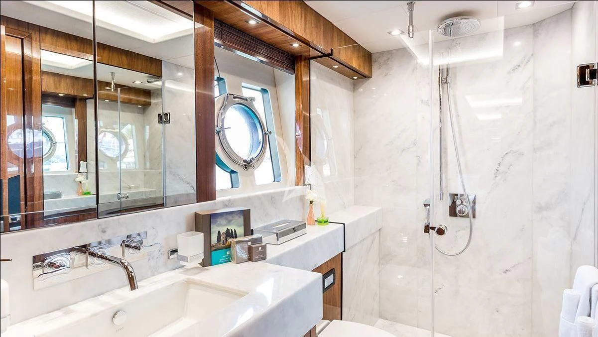 a bathroom with a large mirror aboard STARDUST OF MARY Yacht for Sale