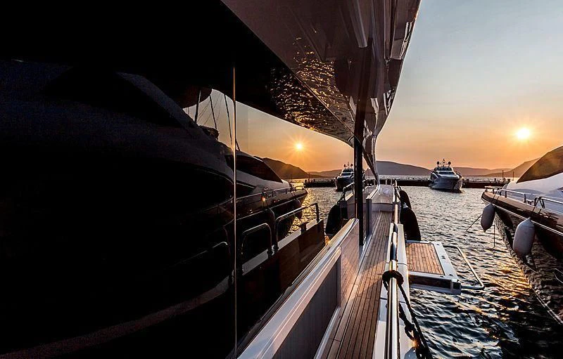 a boat docked at sunset aboard STARDUST OF MARY Yacht for Sale