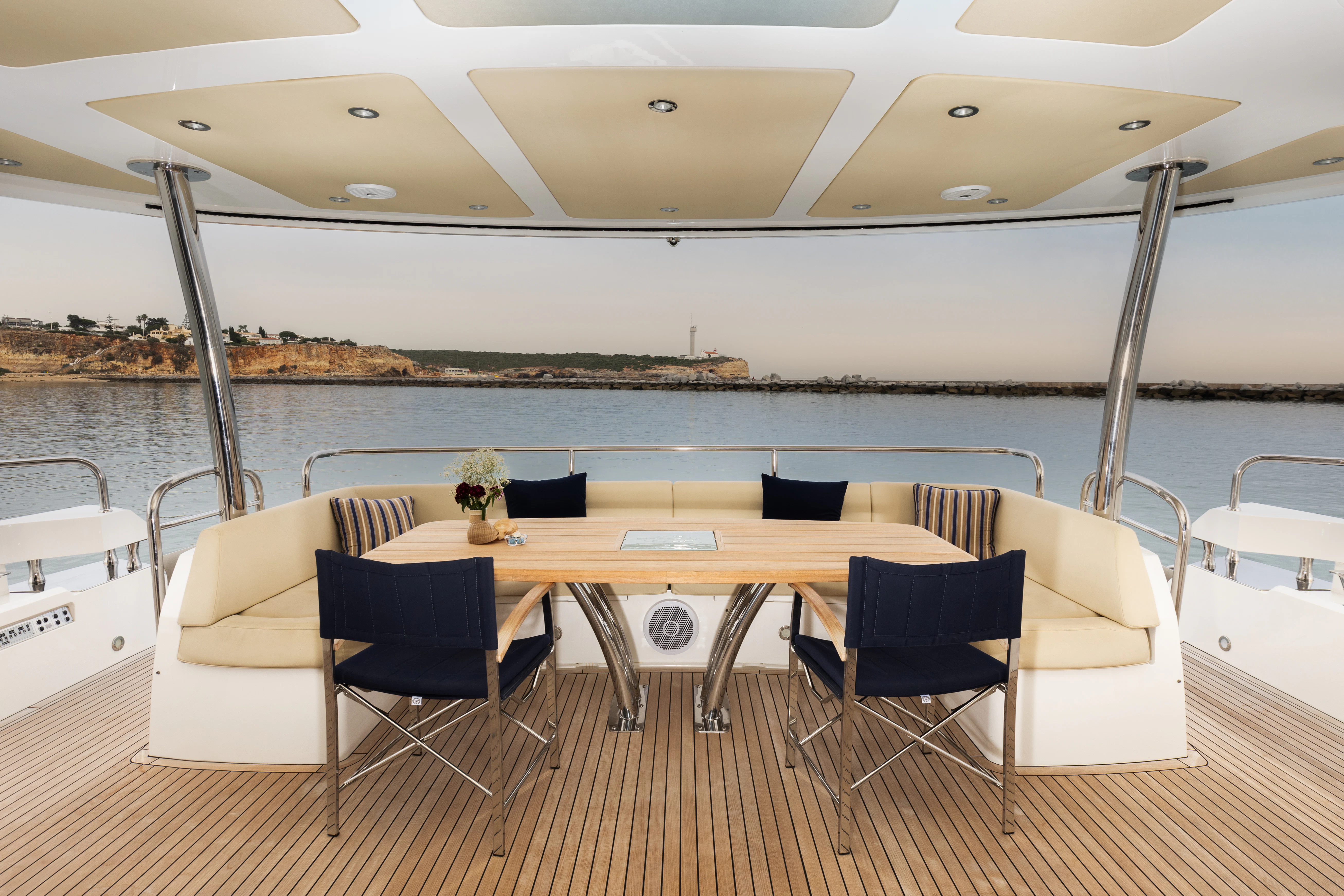 a table and chairs on a deck aboard STARDUST OF MARY Yacht for Sale