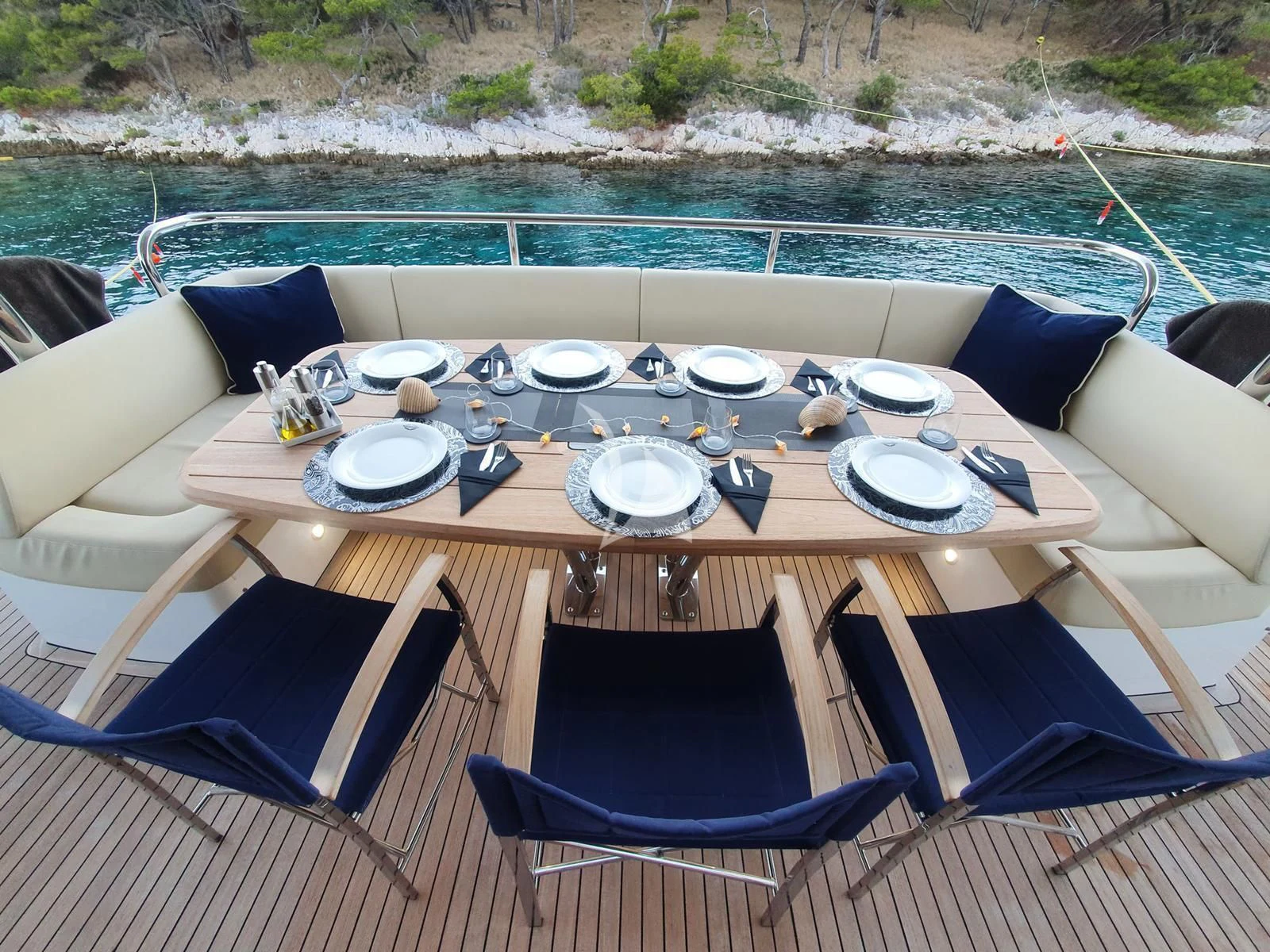 a table set with plates and chairs aboard STARDUST OF MARY Yacht for Sale