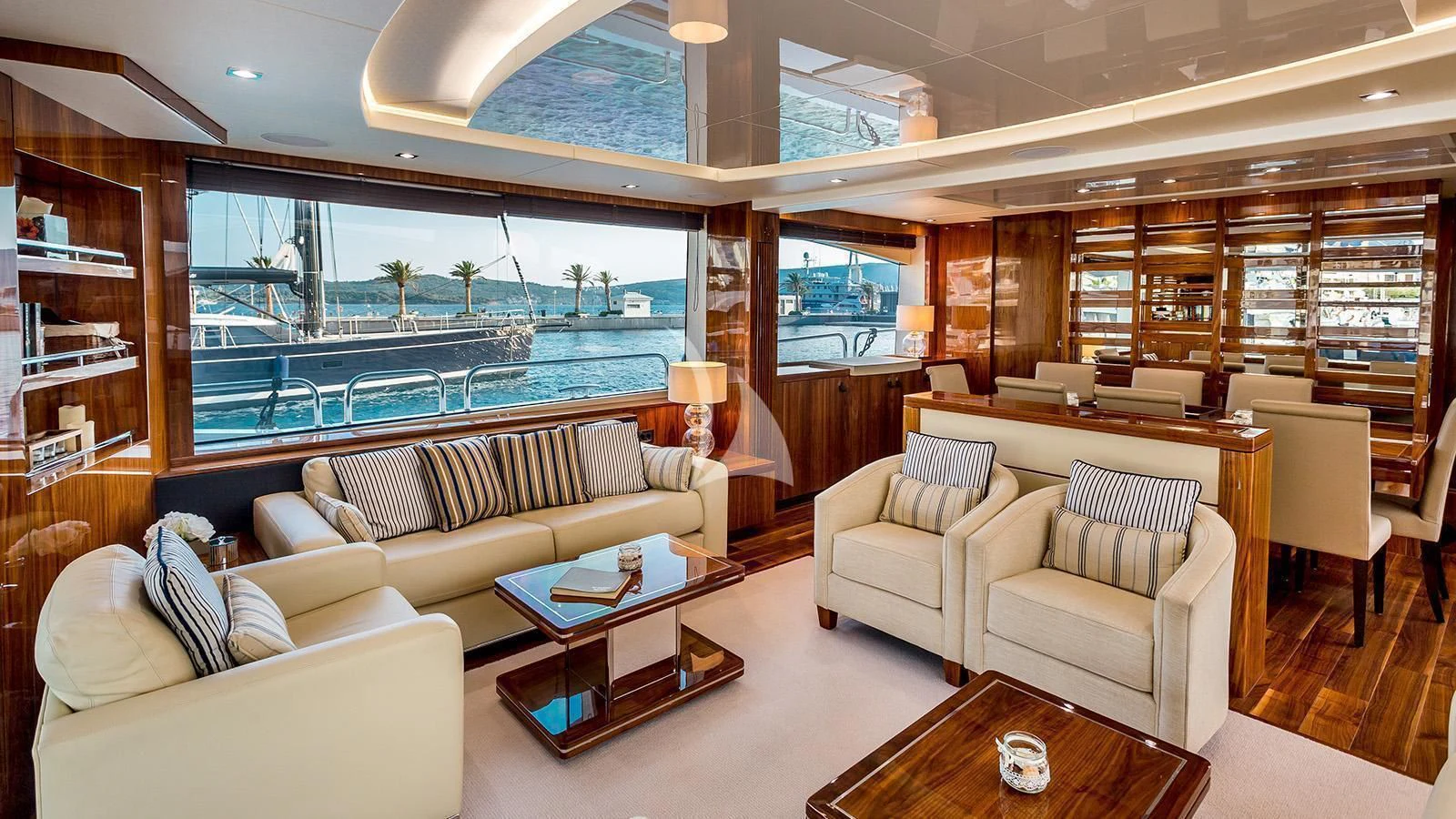 a living room with a large window aboard STARDUST OF MARY Yacht for Sale