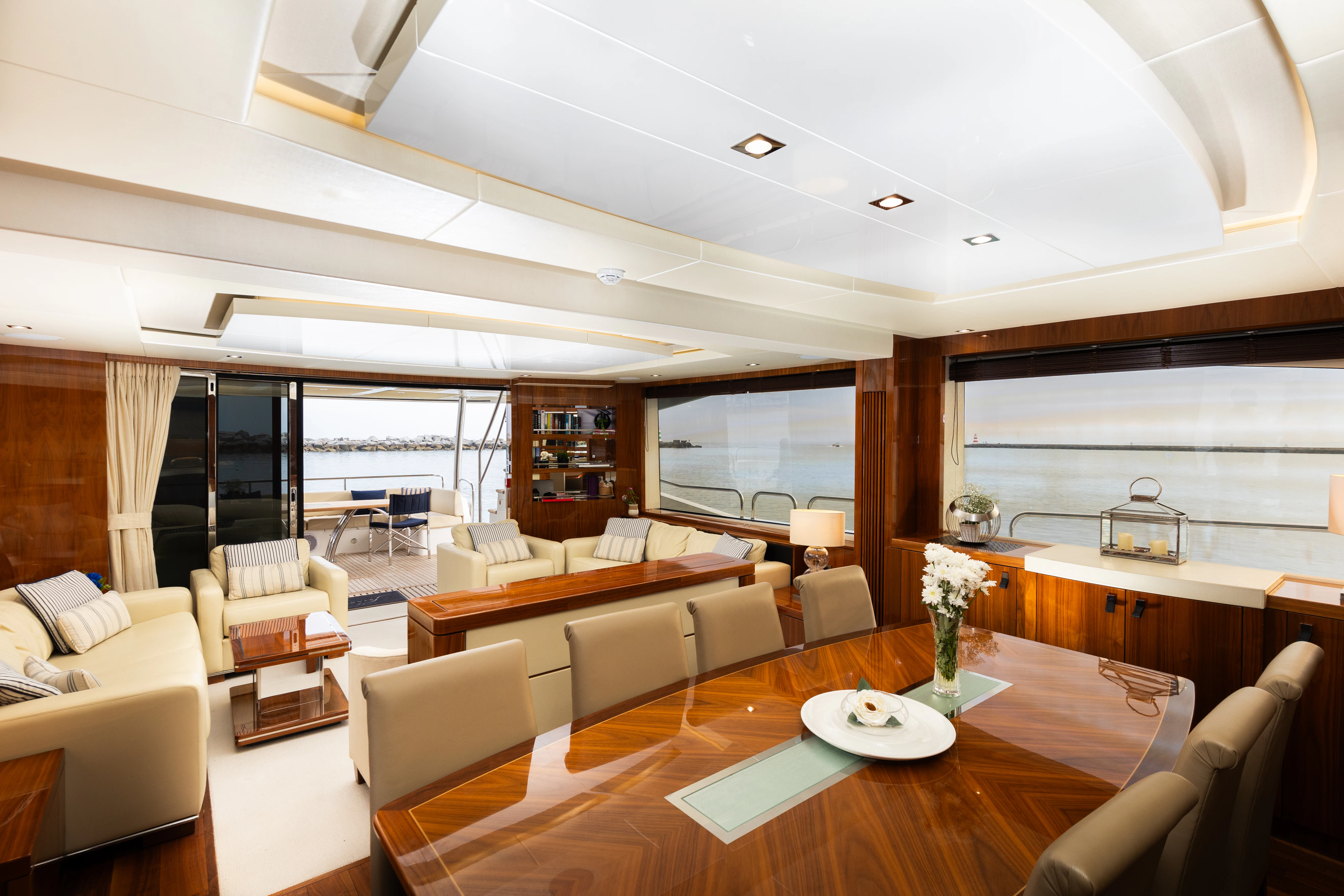 a living room with a large window aboard STARDUST OF MARY Yacht for Sale