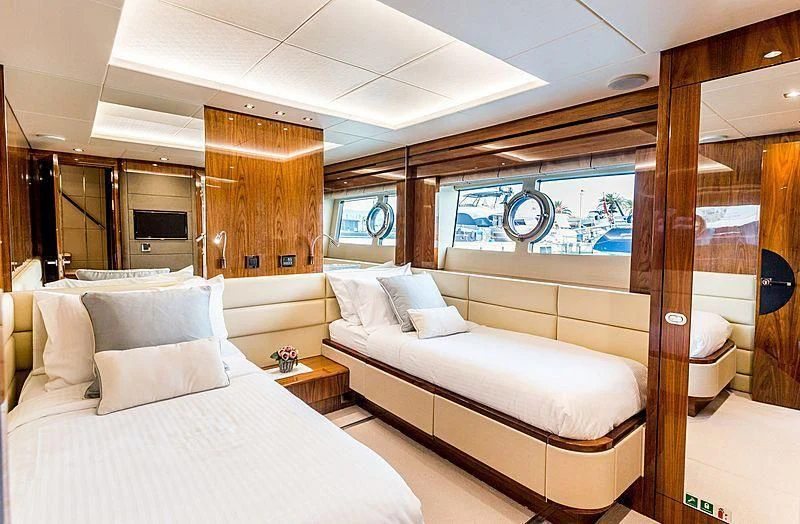 a room with a bed and a window aboard STARDUST OF MARY Yacht for Sale